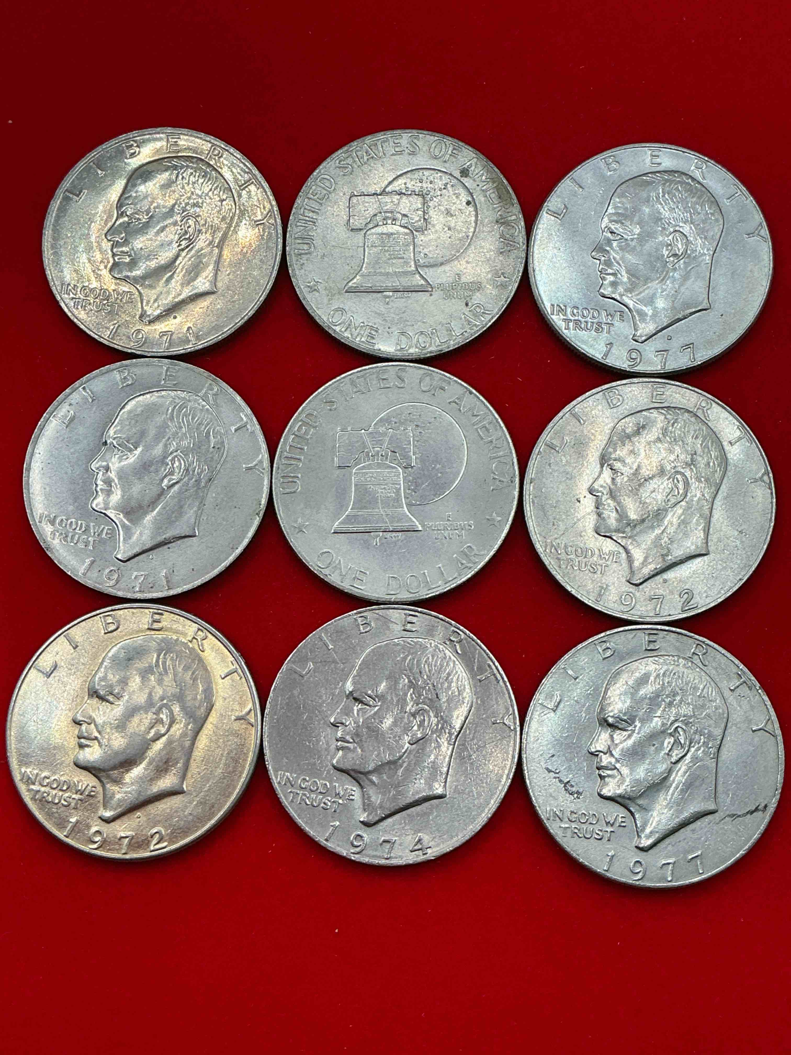 Condition photo showing Good Condition for gorgeous eisenhower dollar coins! 9 coin lot! these striking, large u.s. coins were minted from 1971-1978. here are gorgeous examples of “ike" dollars from 1976 & more! these coins have become immensely popular with collectors & some have great toning!