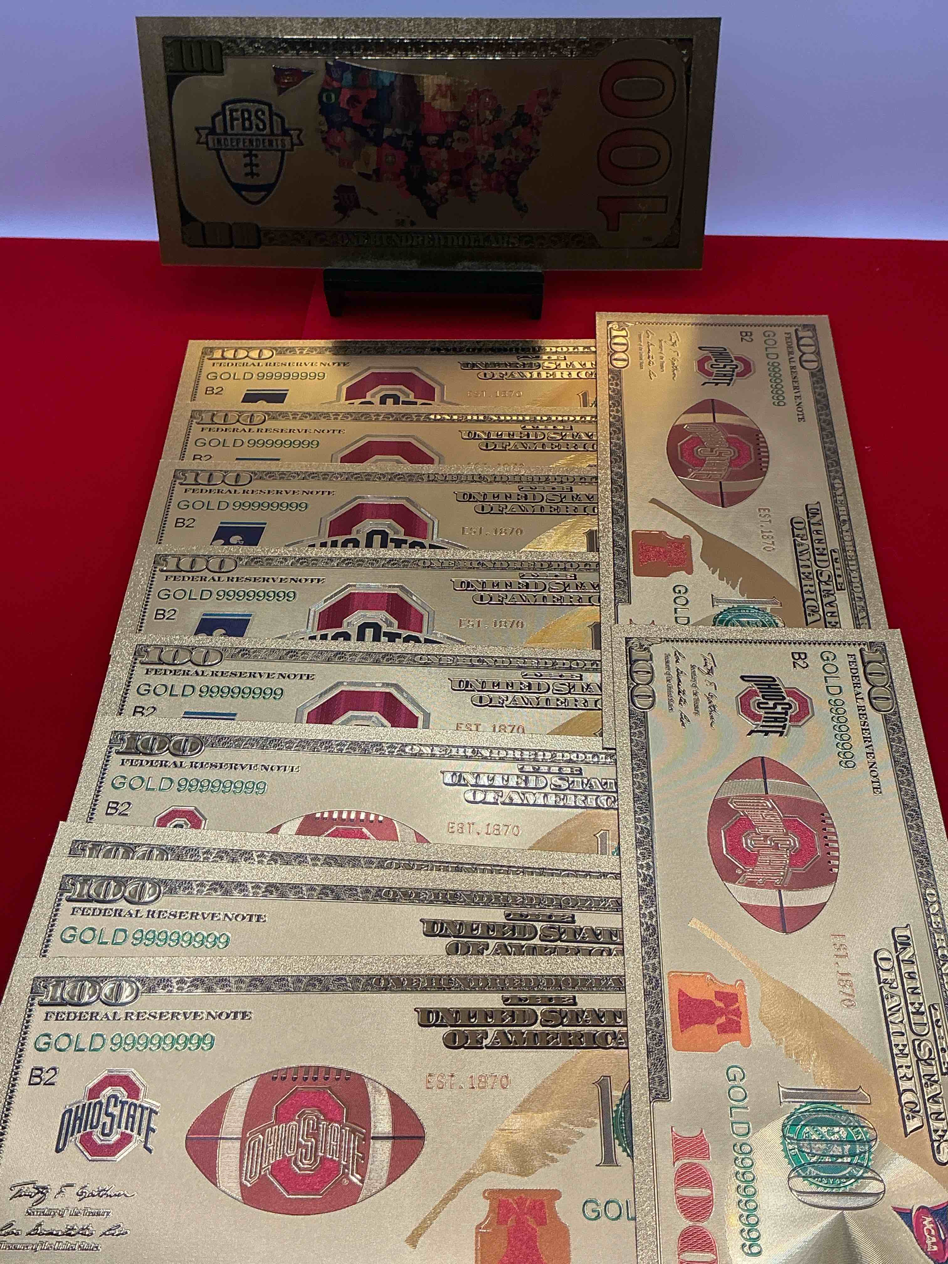 Condition photo showing New/Like New for ohio state university collectible memorabilia! super cool, gold in color 100 dollar commemorative ohio state university bill! cool designs on front & back of bill! osu fans rejoice, cool memorabilia! plastic bills with cool designs!