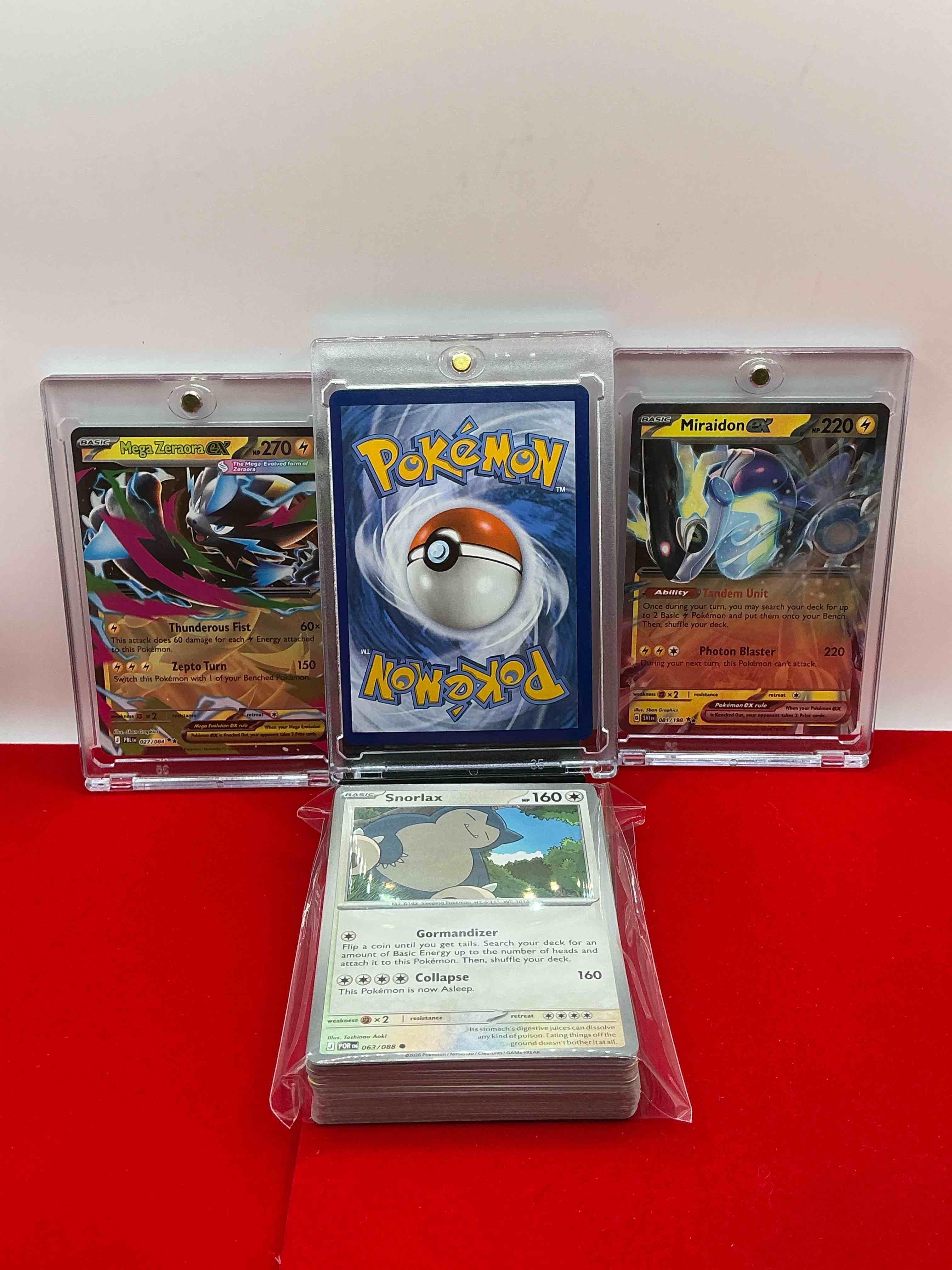 Condition photo showing New/Like New for skeledrirge ex! mega zeraora ex! miraidon ex! along with 50 other pokémon heroes, holos, legends & commons- including holographic cards, stage 1 cards, holos & more! also includes 36 non holo common/ uncommon basic & first stage cards trainers & energy too! perfect set for collectors & enthusiasts!