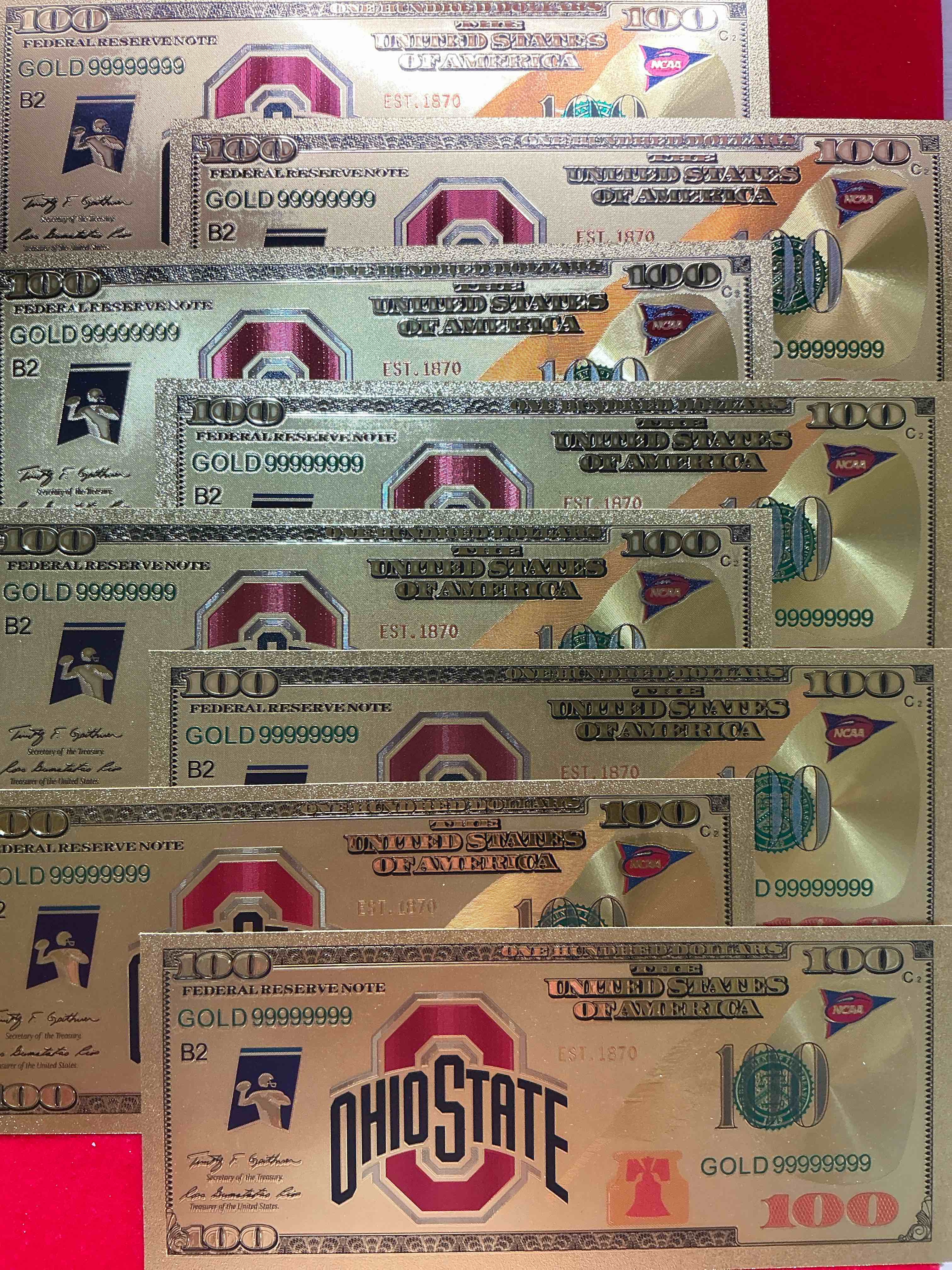 ohio state university collectible memorabilia! super cool, gold in color 100 dollar commemorative ohio state university bill! cool designs on front & back of bill! osu fans rejoice, cool memorabilia! plastic bills with cool designs!