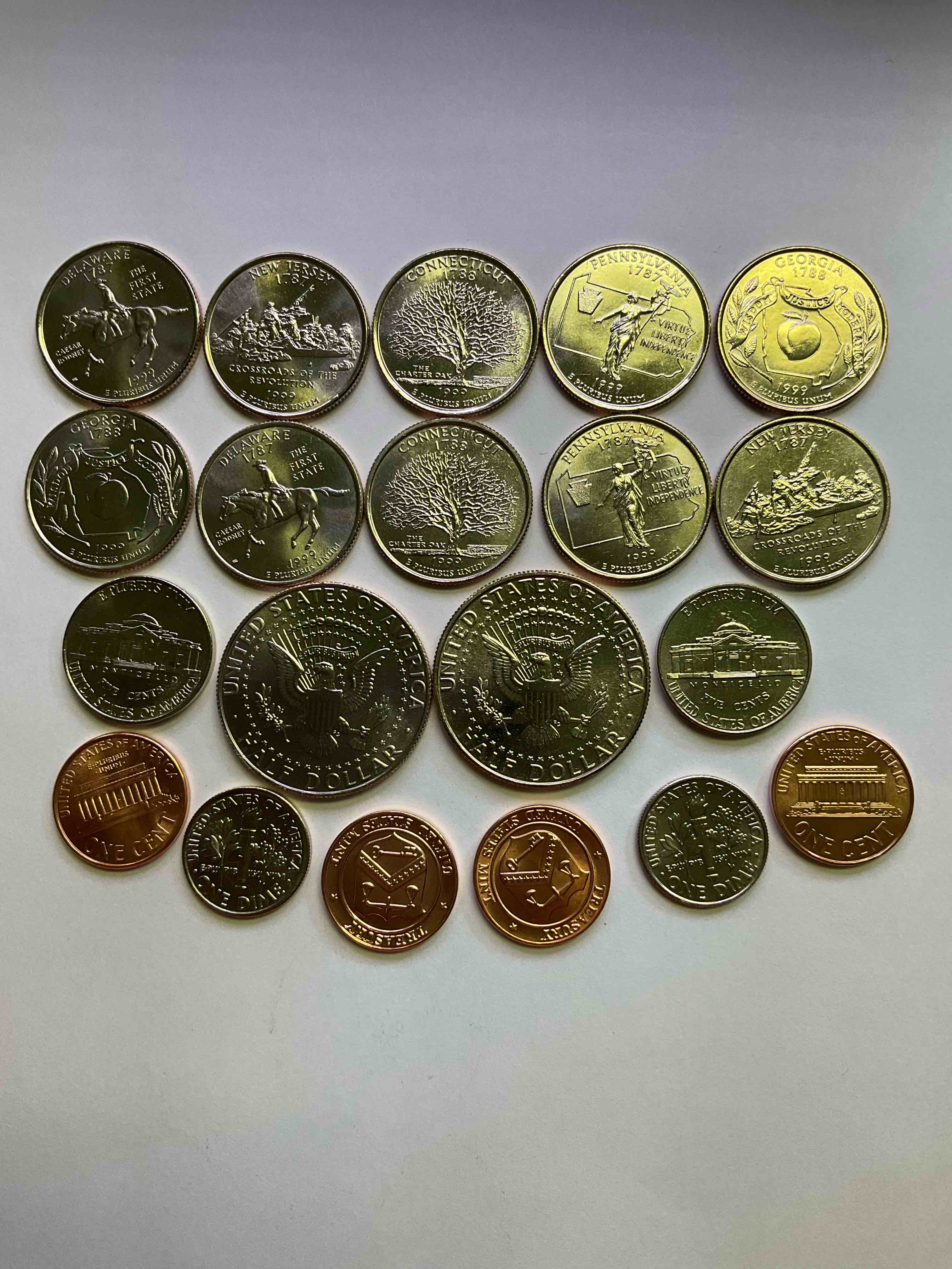 Condition photo showing New/Like New for 1999 uncirculated mint set coins! 20 coin mint set from philadelphia & denver! 20 coin uncirculated lot, with quarters, nickels, half dollars, dimes, pennies & more! uncirculated coin craziness!