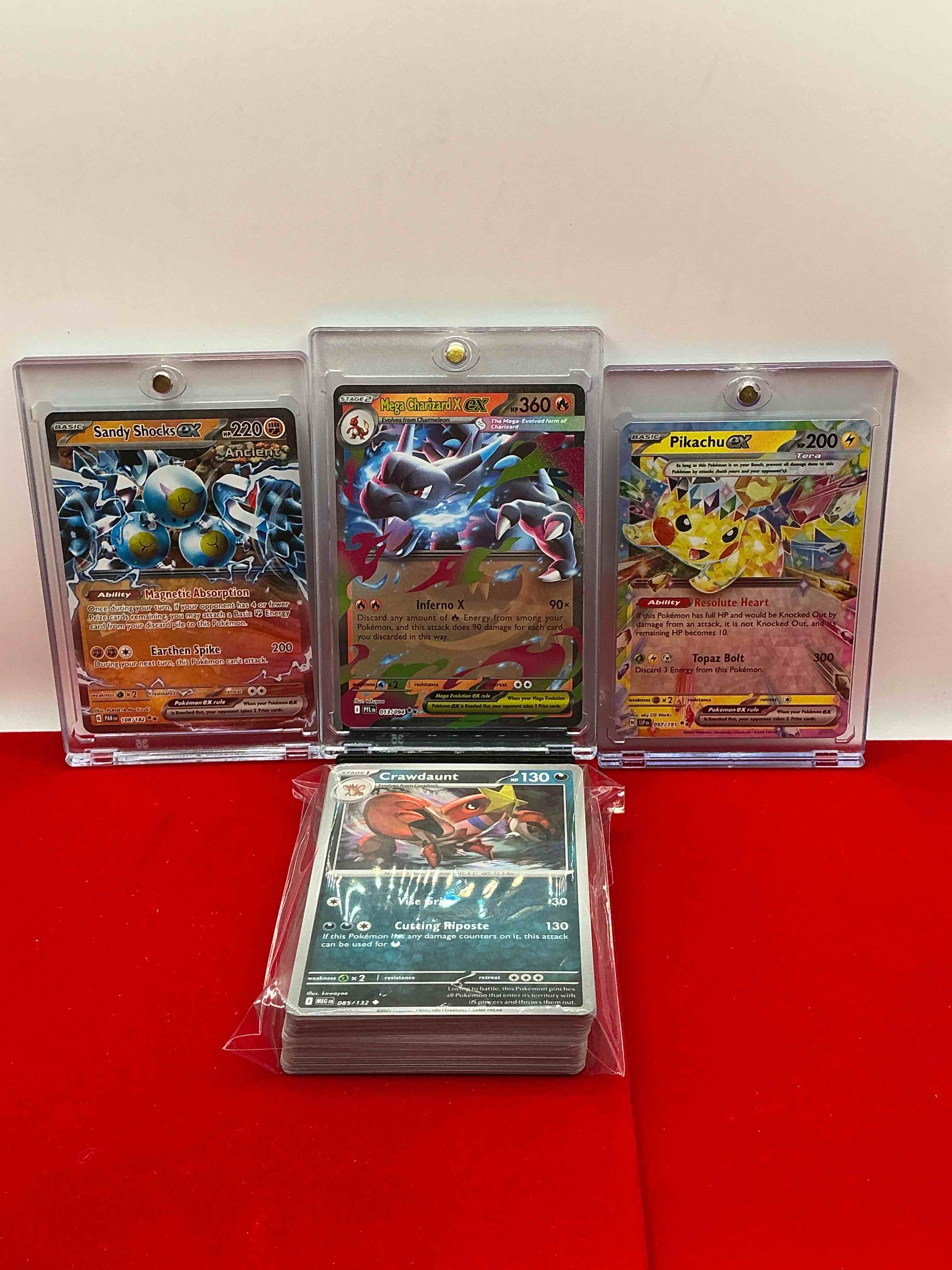 Condition photo showing New/Like New for mega charizard ex! pikachu ex! sandy shocks ex! along with 50 other pokémon heroes, holos, legends & commons- including holographic cards, cool holos & more! includes  non holo common/ uncommon basic & first stage cards & could even include trainers & energy too! perfect set for collectors & enthusiasts!