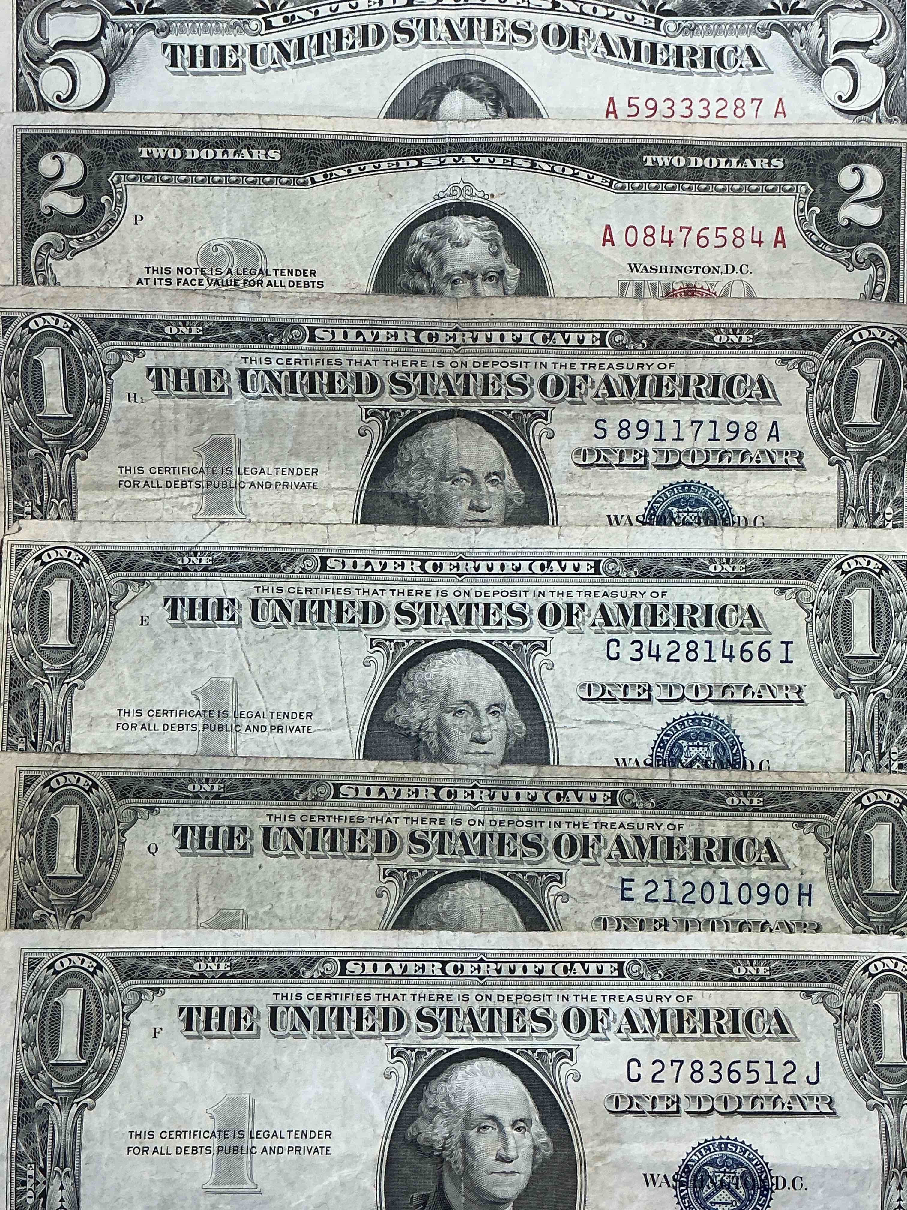 rare american dollar bills! red seal five dollar bill & red seal two dollar bill, along with silver certificates! five dollar bill ultra rare & in good condition, red seal two dollar bill in good condition & silver certificates produced from 1878 to 1964 & are still considered legal tender at face value. here are gorgeous, circulated 1935 & 1957 u.s. one dollar silver certificate, with highly collectible "blue seal!* own an awesome piece of history! american dollar lot! 