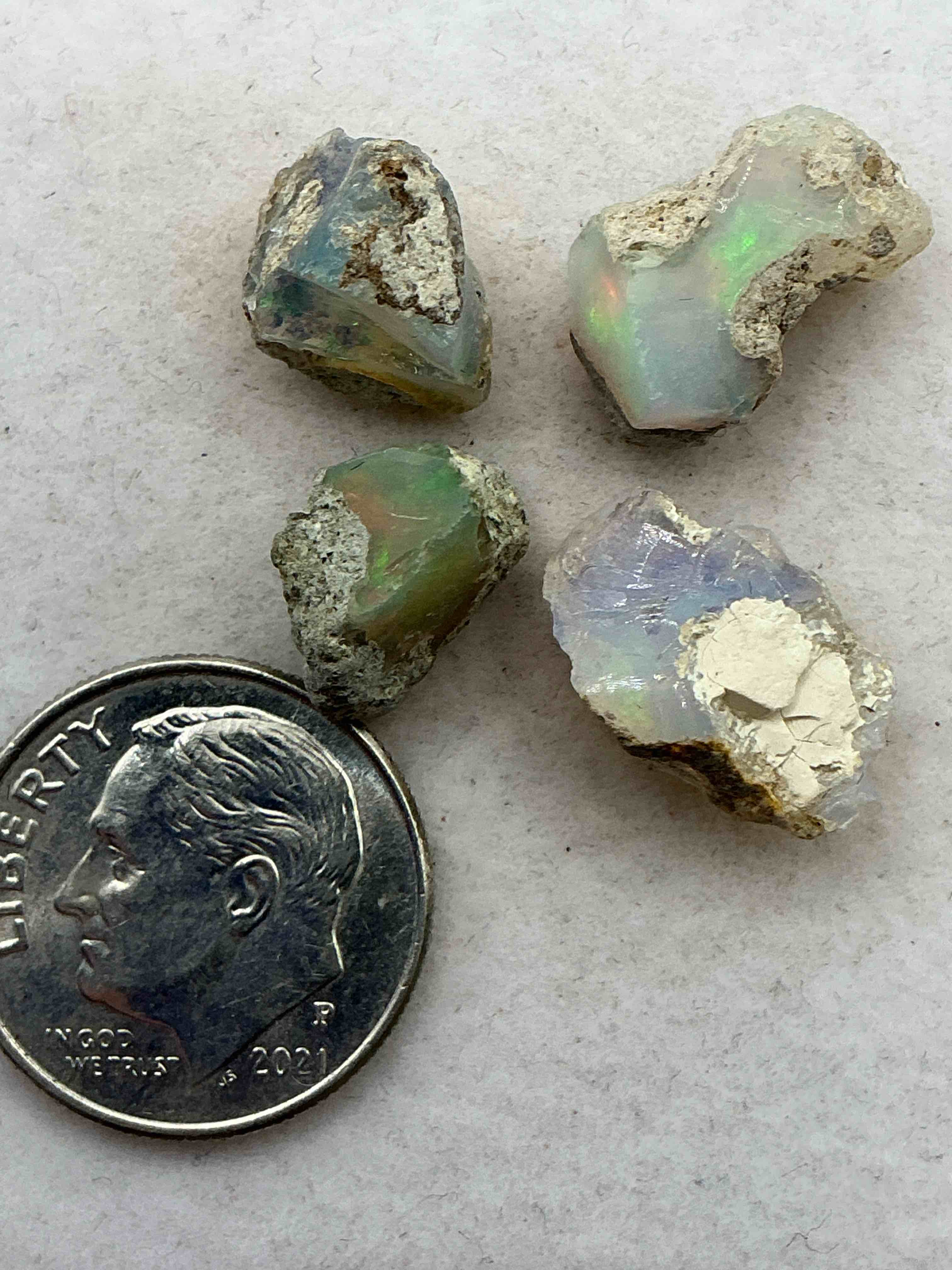 Opal Precious Gemstone, Authentic! Opal Gemstone, Cut And/Or Faceted & Polished! Opals Are Famous For Their. Stunning Clarity & Hues & Likely Originate From Ethiopia. Opals Are Believed To Promote Hope, Purity & Love. The U.S. Dime In Image Is For Size Reference Only (Not Included). Own An Amazing, Stunning, Unique Opal Gemstone!