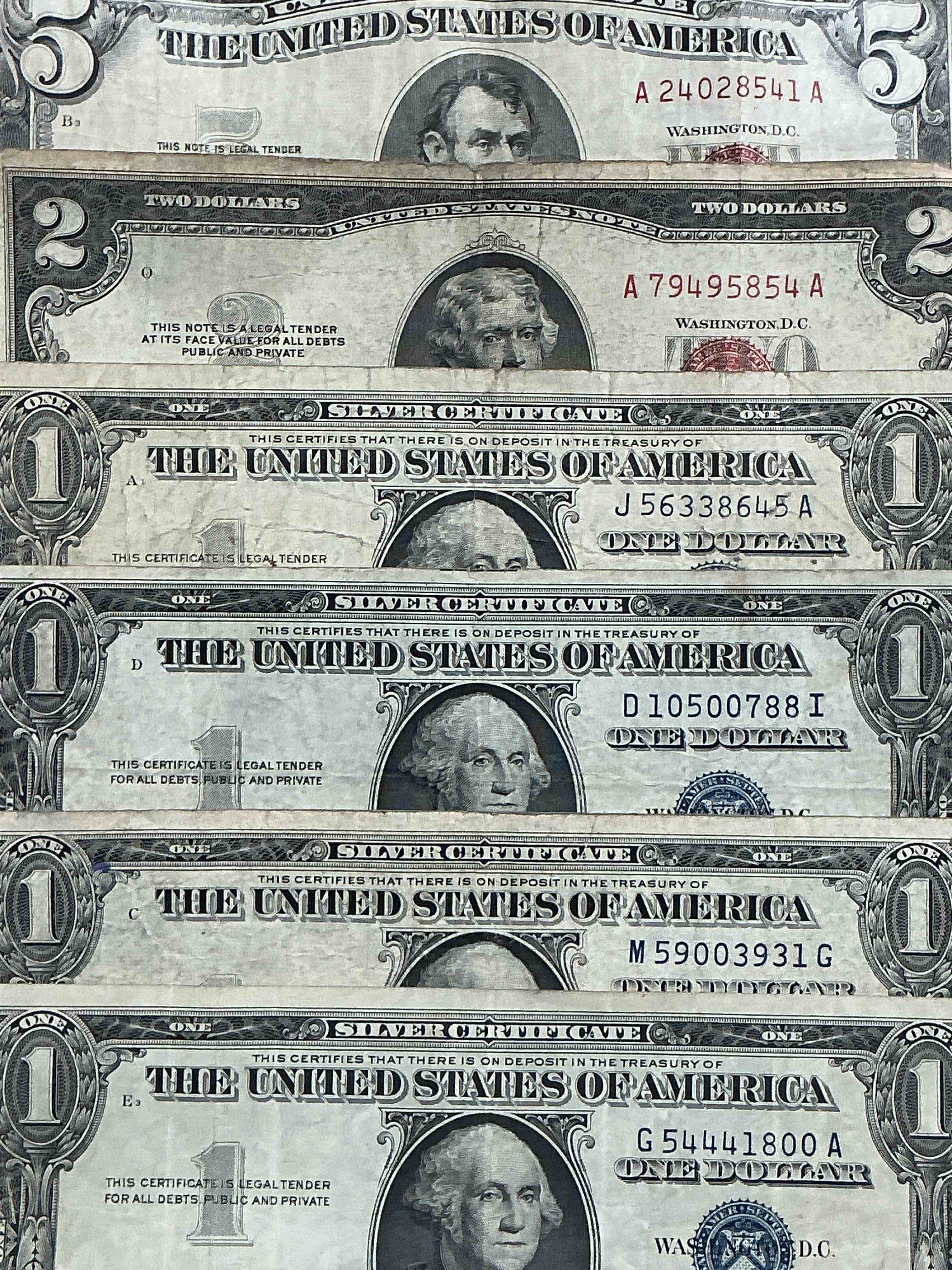 Rare American Dollar Bills! RED Seal Five Dollar Bill & Red Seal Two Dollar Bill, Along With Silver Certificates! Five Dollar Bill Ultra Rare & In Good Condition, Red Seal Two Dollar Bill In Good Condition & Silver Certificates Produced From 1878 To 1964 & Are Still Considered Legal Tender At Face Value. Here Are Gorgeous, Circulated 1935 & 1957 U.S. One Dollar Silver Certificate, With Highly Collectible "Blue Seal!* Own An Awesome Piece Of History! American Dollar Lot! 