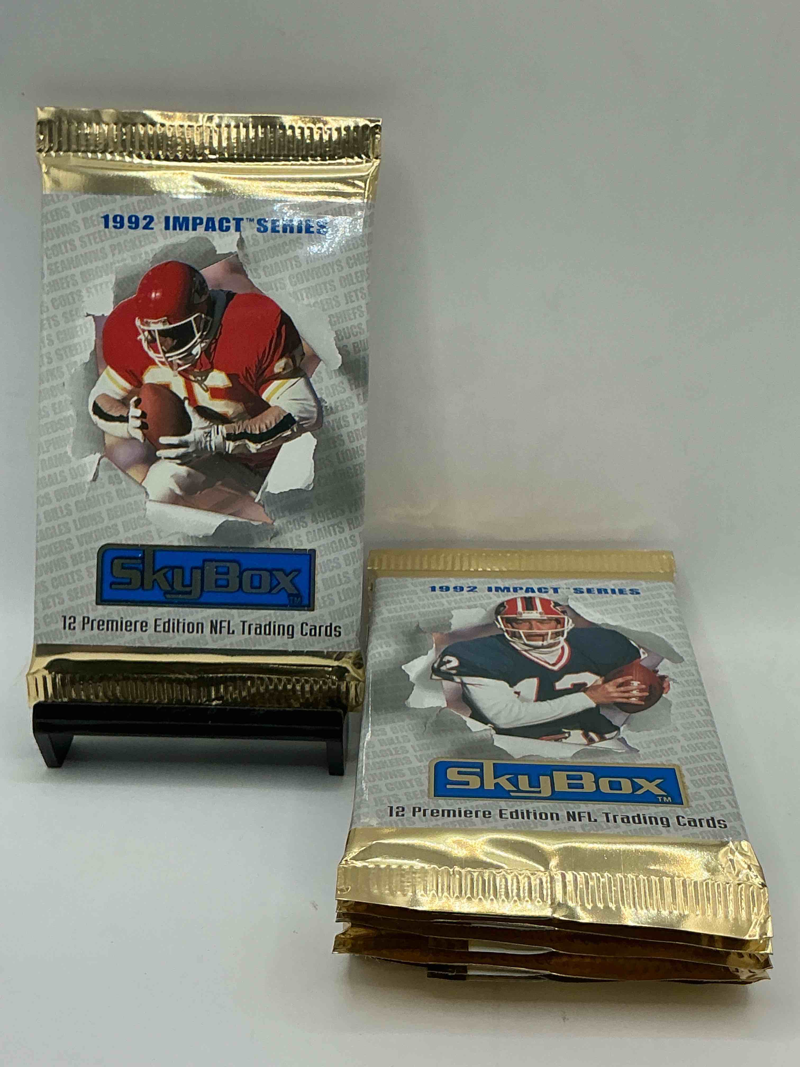 football insanity! 1992 skybox impact series premiere edition football card packs!all unopened & straight from box! high end cards! search for nfl stars brett favre, jim kelly, warren moon, joe montana, barry sanders & so many more, direct from original box!