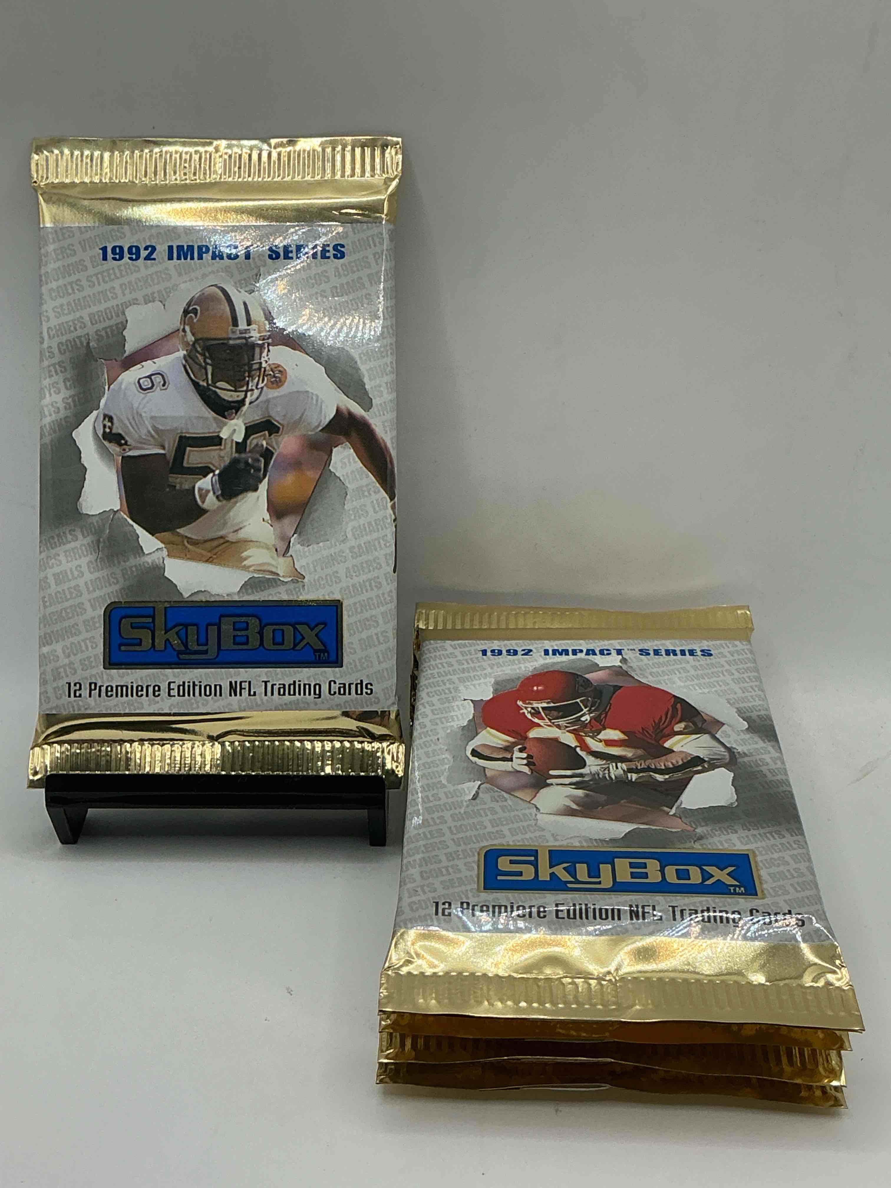 football insanity! 1992 skybox impact series premiere edition football card packs!all unopened & straight from box! high end cards! search for nfl stars brett favre, jim kelly, warren moon, joe montana, barry sanders & so many more, direct from original box!