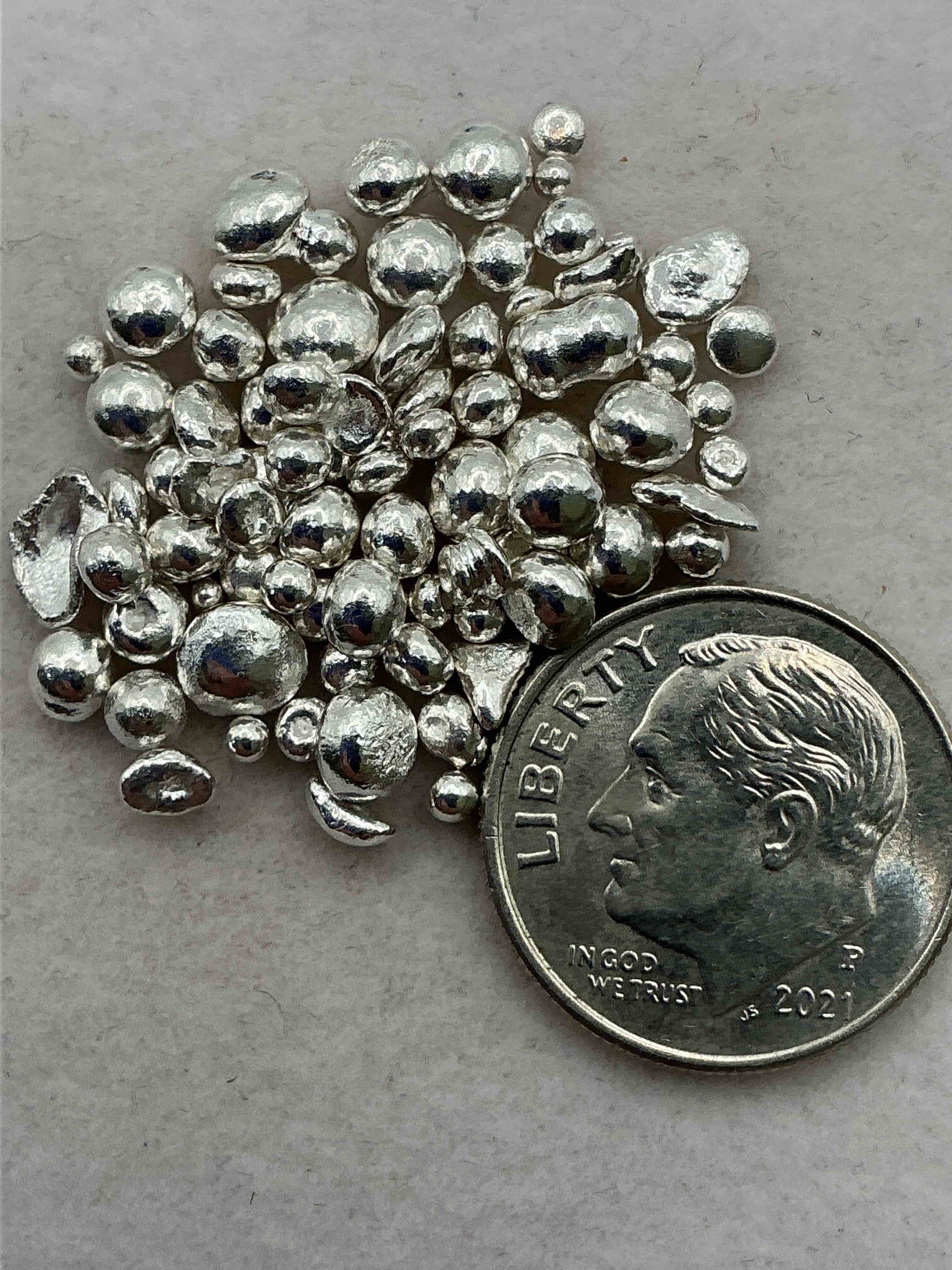 silver nuggets! .999 us fine silver, in small nugget form! total weight of all nuggets in lot approximately 9 grams, bid is per nugget! a cool way to invest in fine us silver! includes collector capsule!