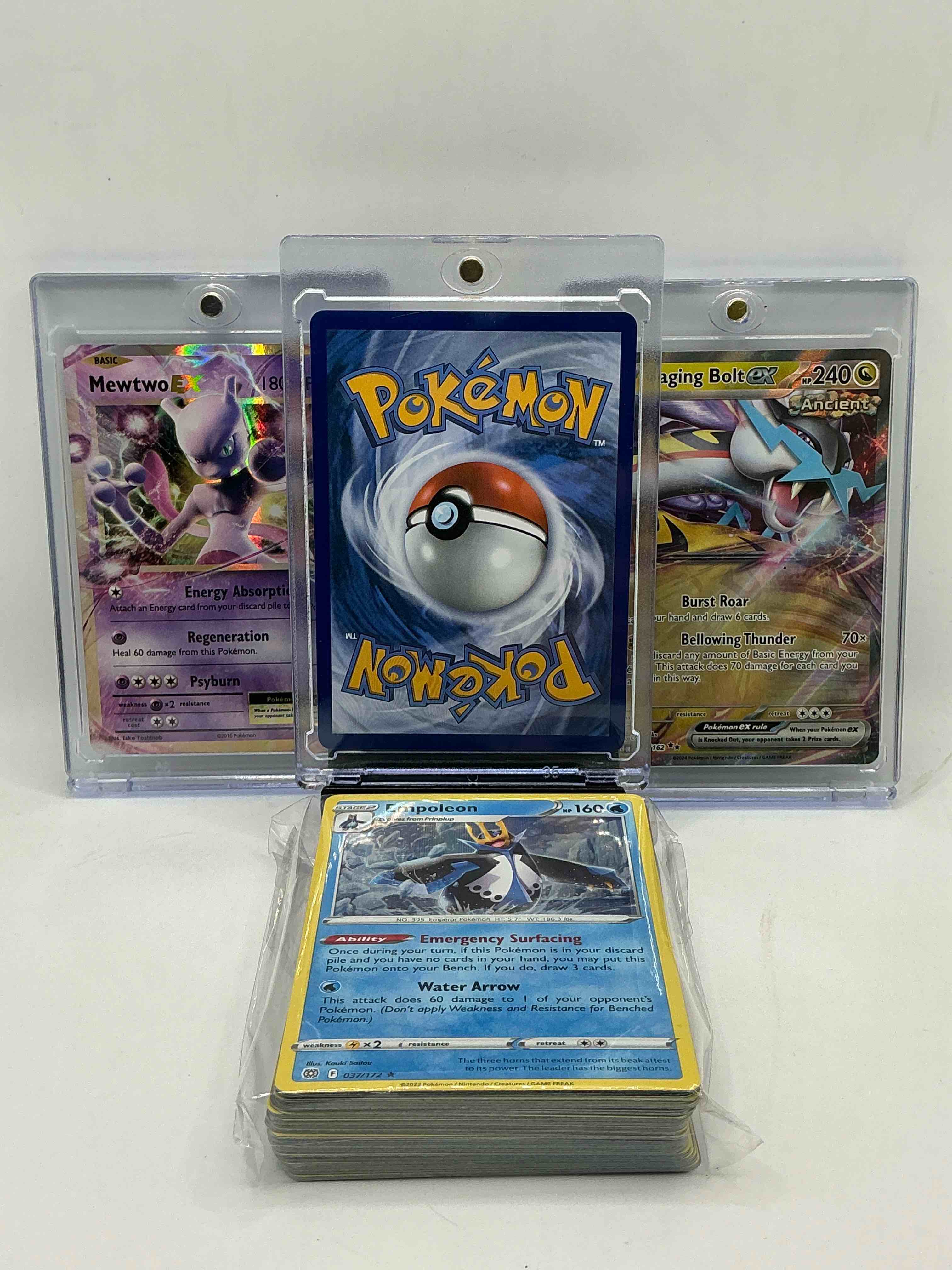 Condition photo showing New/Like New for mega charizard x ex! mewtwo ex! raging bolt ex! along with 50 other pokémon heroes, holos, legends & commons- including holographic cards, stage 2 cards, holos in all forms & more! also includes 36 non holo common/ uncommon basic & first stage cards trainers & energy too! perfect set for collectors & enthusiasts!