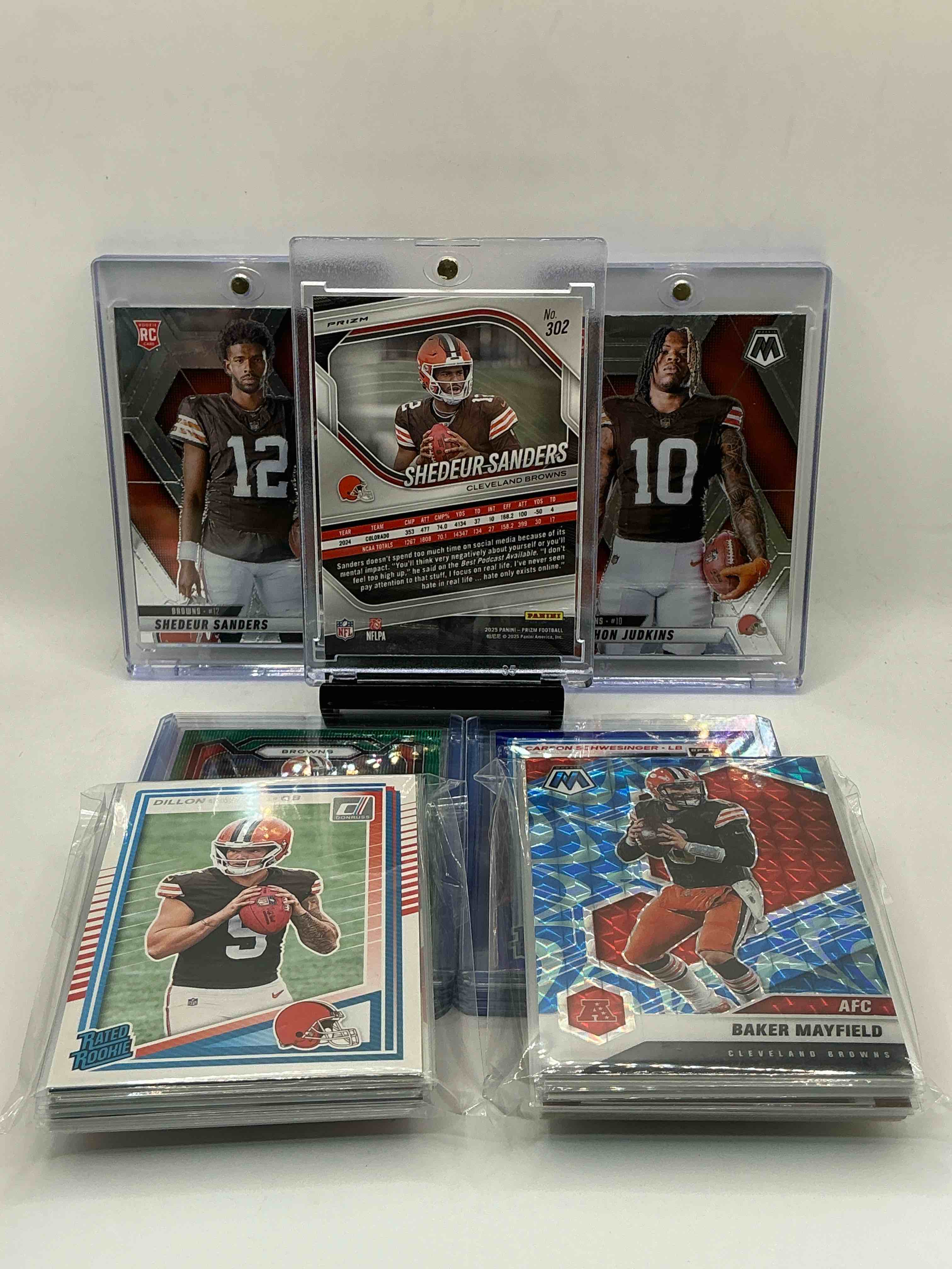 Condition photo showing New/Like New for cleveland browns bonanza! 2025 silver pink prizm rookie shadeur sanders! 2025 mosaic rookie quinshon judkins! 2025 opic rated rookie carson schwesinger! so many browns legends, rookies, heroes & commons in this 50 card lot! wow!