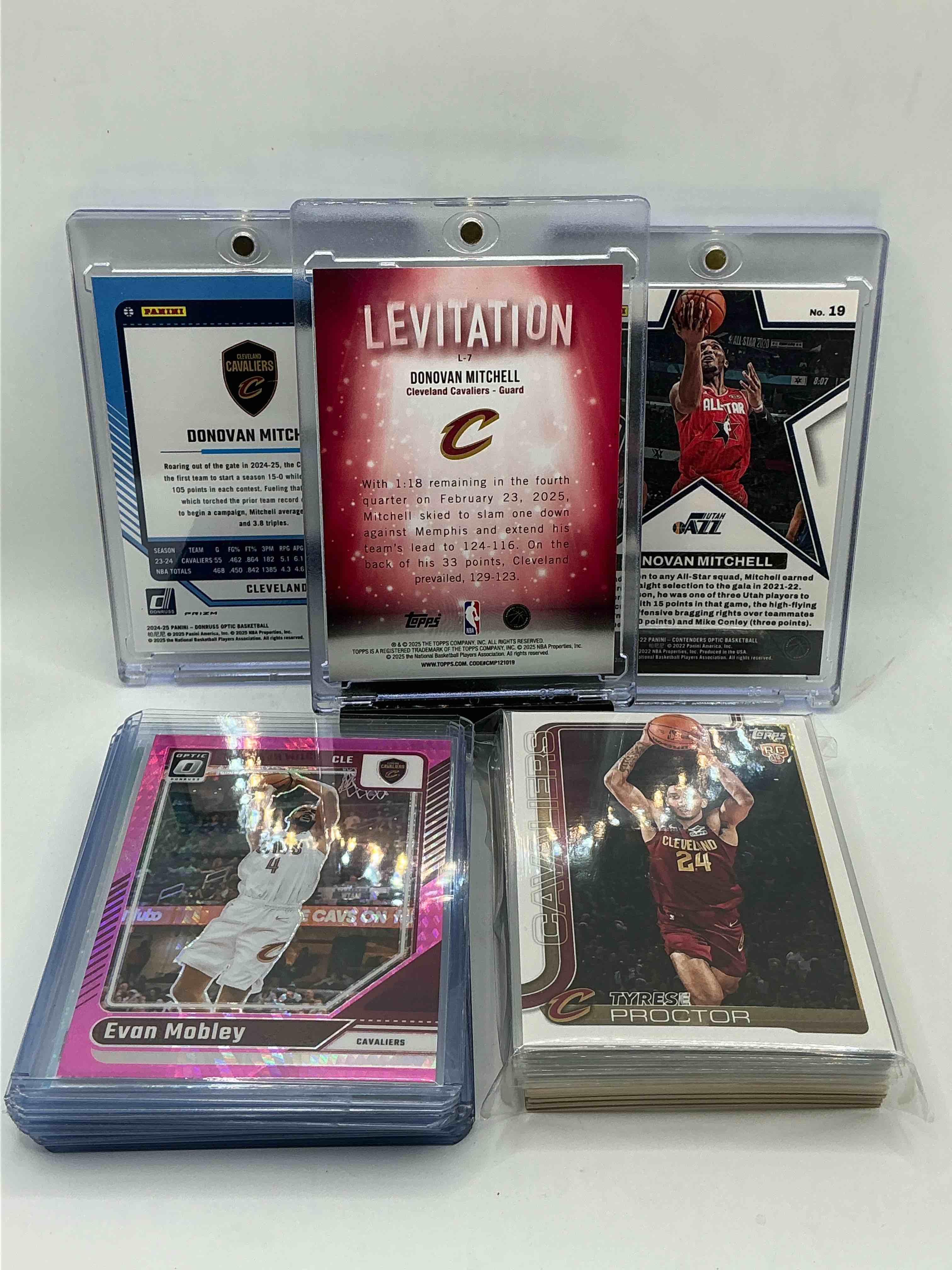 Condition photo showing New/Like New for cavaliers playoff craziness! 2025 topps levitation silver donovan mitchell! 2024 optic silver prizm donovan mitchell! 2021optic silver prizm all star donovan mitchell! along with 50 other cavaliers rookies, heroes, legends & rookies!