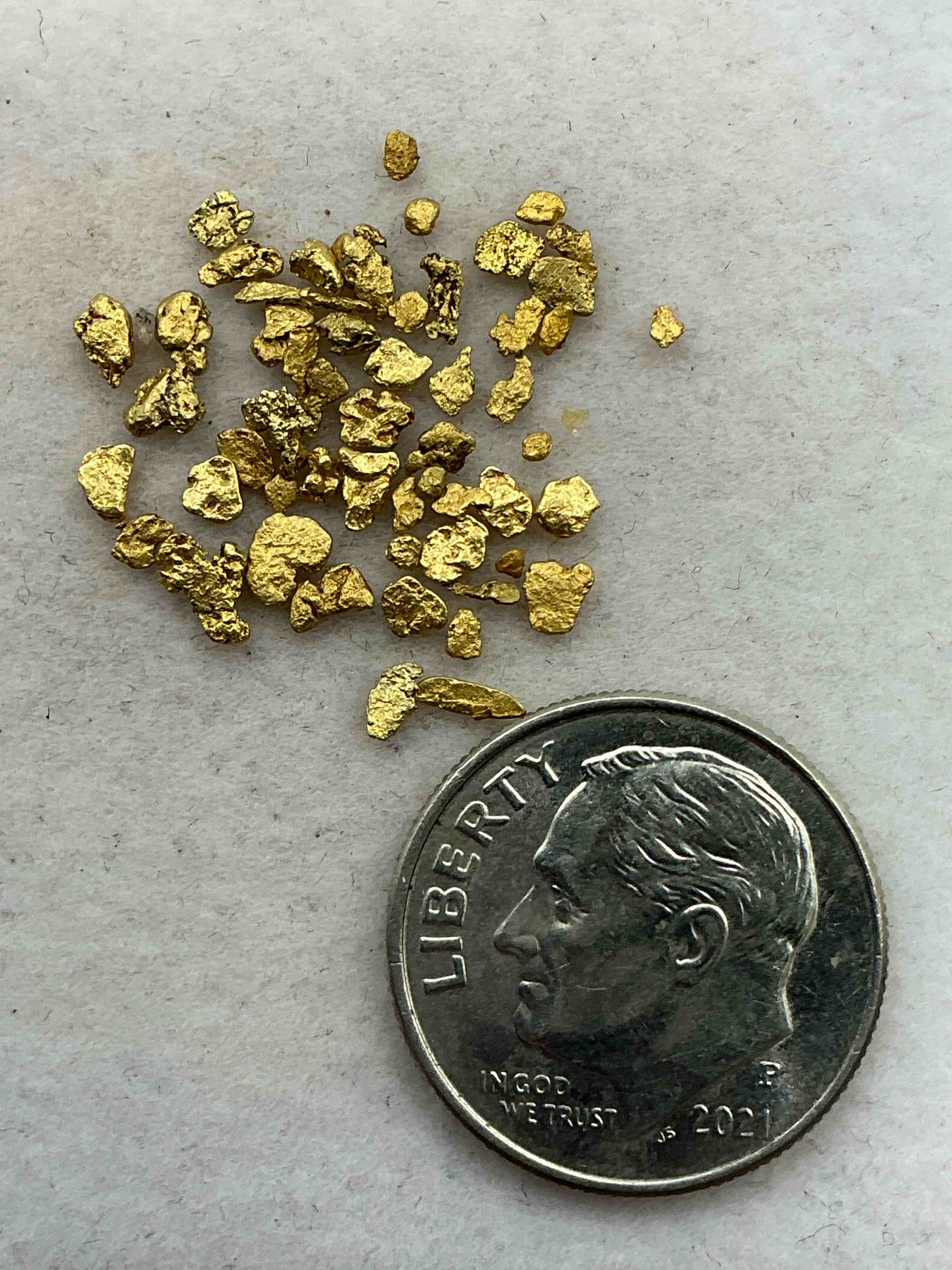 Condition photo showing Good Condition for genuine gold nuggets! gold nuggets fresh from prospecting north carolina mountains, total weight of all nuggets is approximately one gram. these gold nuggets typically test at between approx 22-24 karat. gold in raw, prospected form is extremely hard to find & much rarer than any refined form. get in on the gold craze... gold has increased in value over 40% since 2025! u.s. dime for size reference only (not included). gold vile in image included. own genuine, gold nuggets! 
