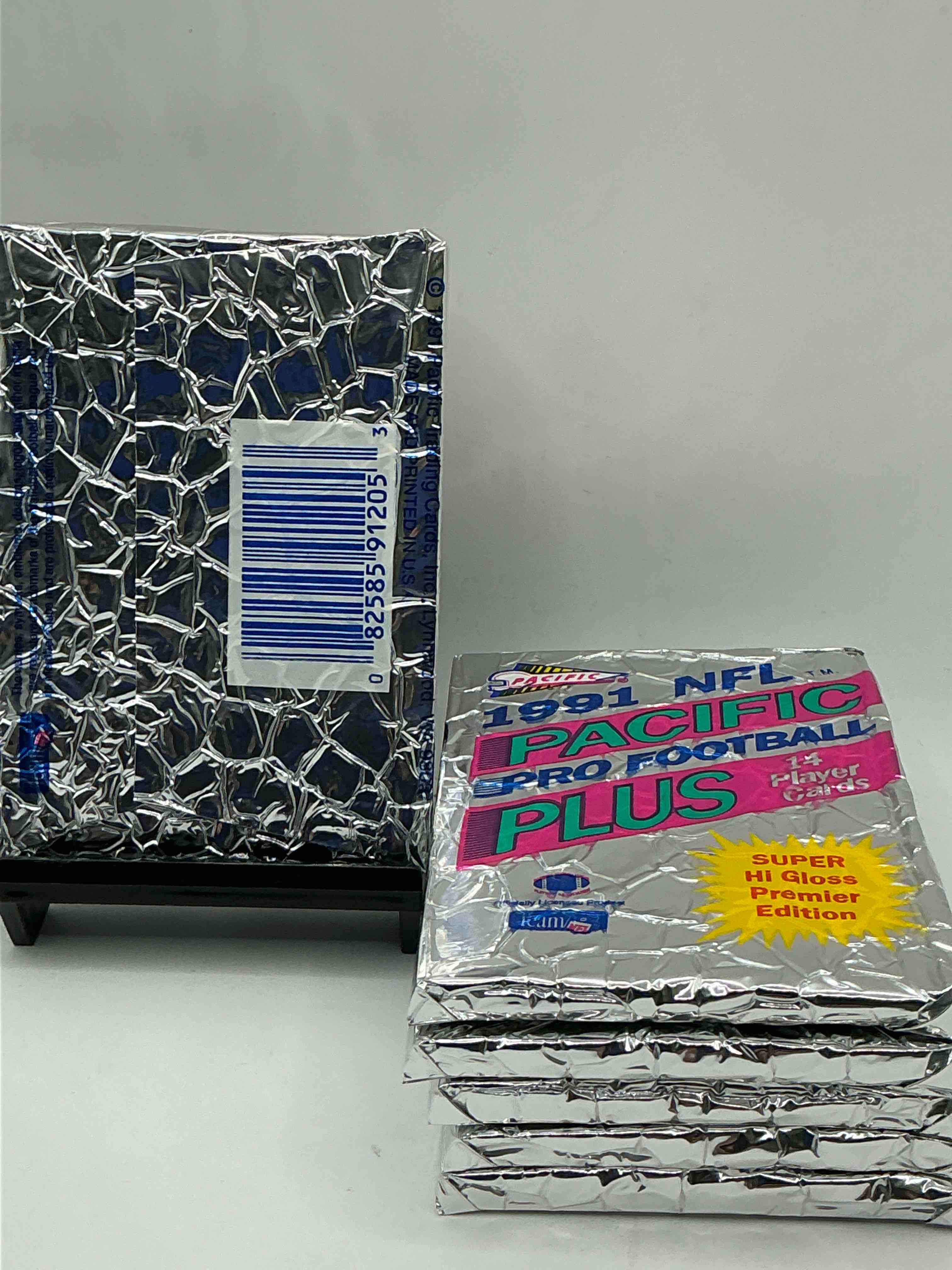Condition photo showing New/Like New for 1991 pacific football, something you hardly ever see! pacific footbell sealed card pack, direct from original retail case. search for brett favre rookie, barry sanders, jerry rice & so much more! hard to find!