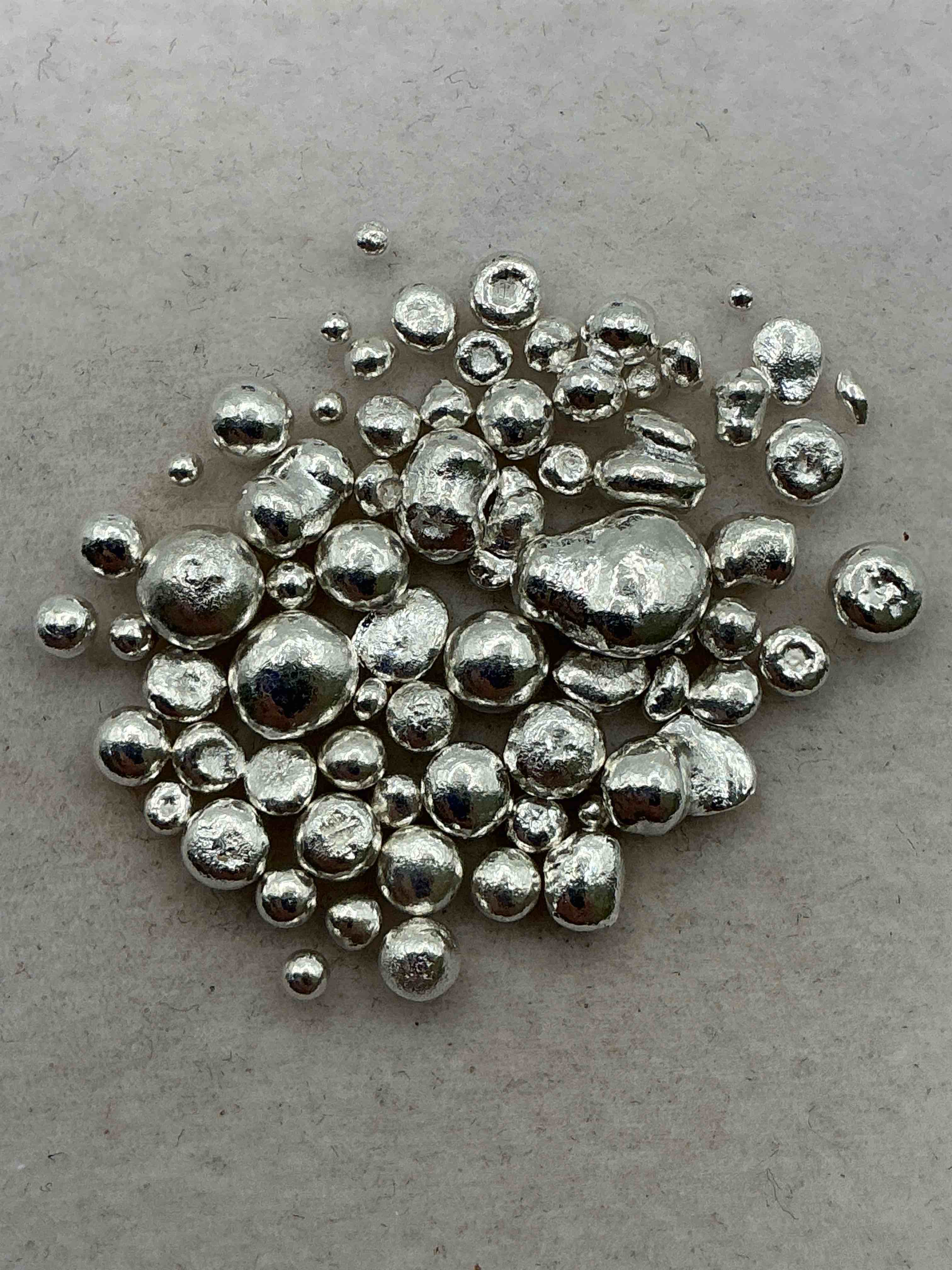 silver nuggets! .999 us fine silver, in small nugget form! total weight of all nuggets in lot approximately 9 grams, bid is per nugget! a cool way to invest in fine us silver! includes collector capsule!