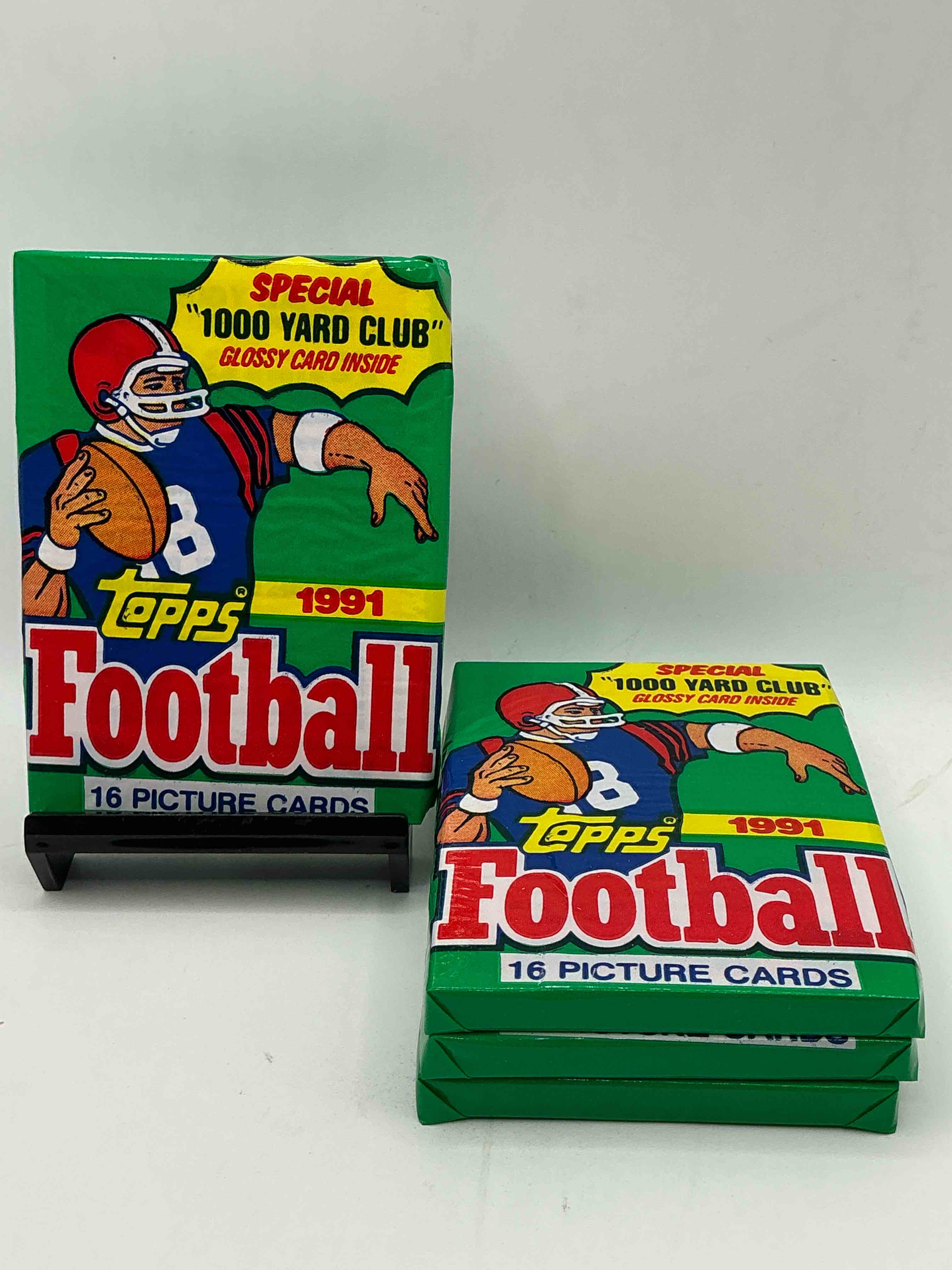 1991 topps football unopened sports card pack, direct from original retail case. search for early barry sanders, emmitt smith, jerry rice & joe montana!