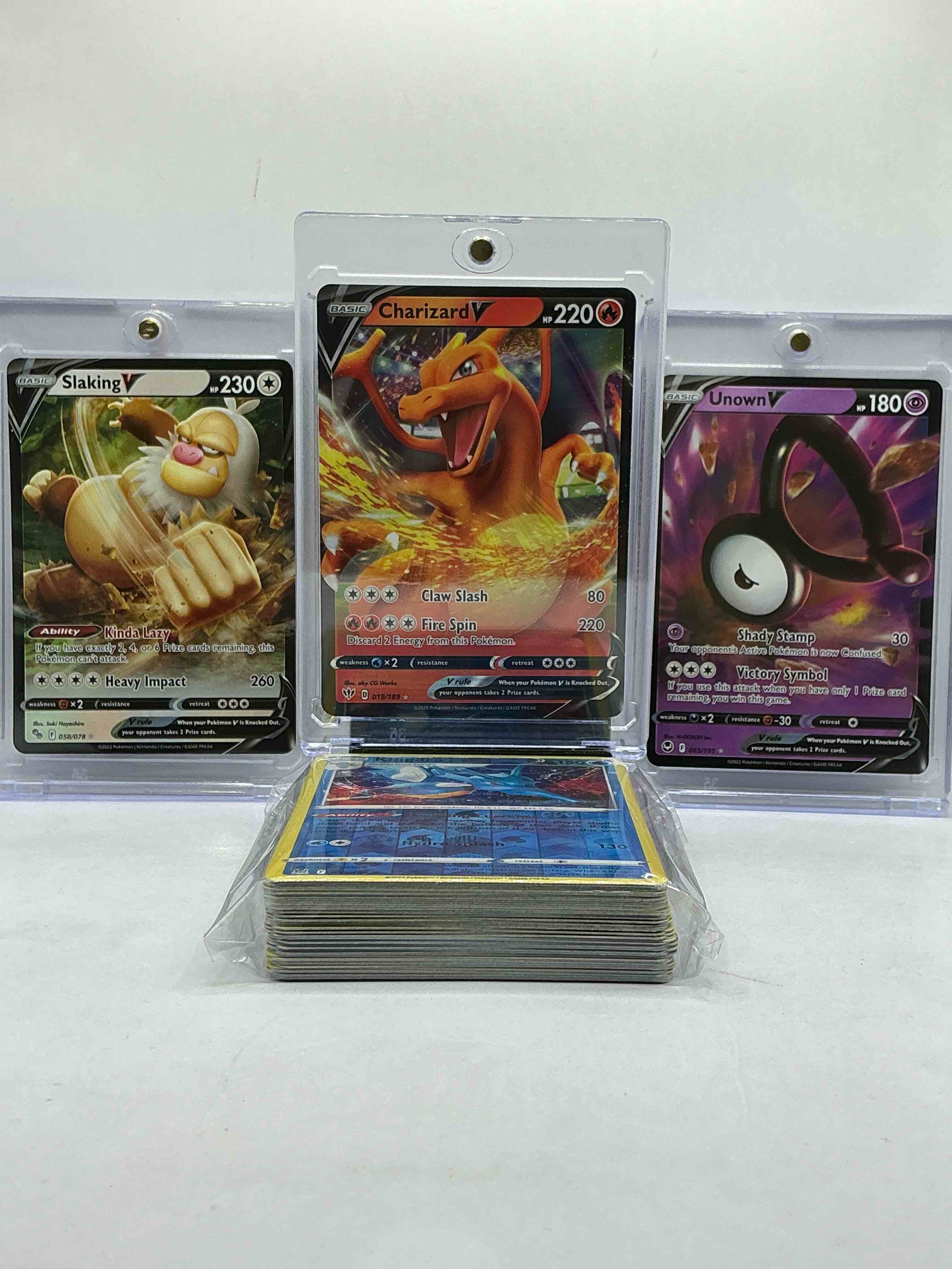Charizard V, Unown V, Slaking V & More! Ultra Rare V Insanity! Pokémon Palooza! Along With 50 Other Pokémon Heroes, Holos, Legends & Commons- Including Holographic Cards, Stage 2 Cards, Holos In All Forms & More! Also Includes 36 Non Holo Common/ Uncommon Basic & First Stage Cards Trainers & Energy Too! Perfect Set For Collectors & Enthusiasts!