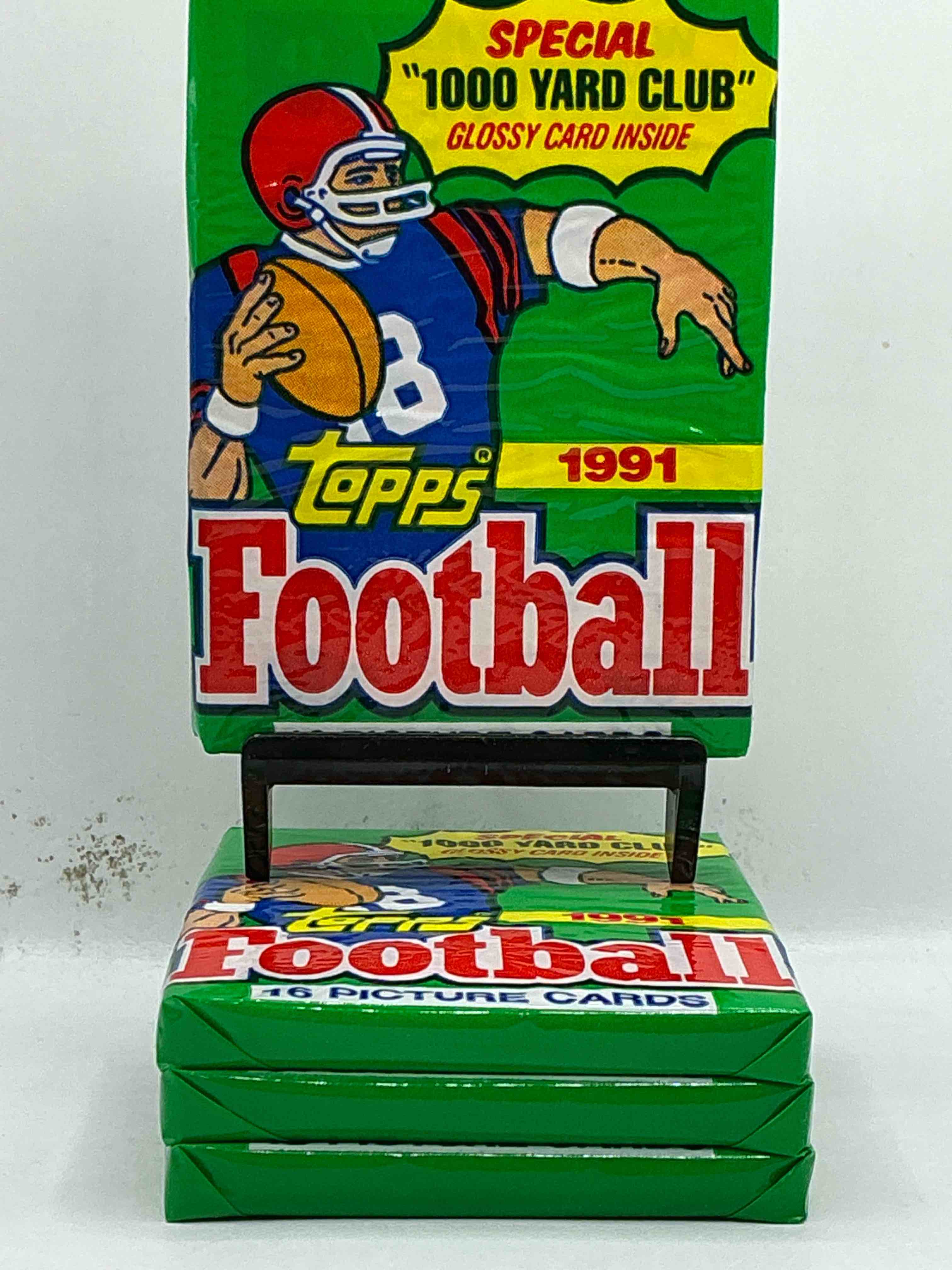 1991 topps football unopened sports card pack, direct from original retail case. search for early barry sanders, emmitt smith, jerry rice & joe montana!