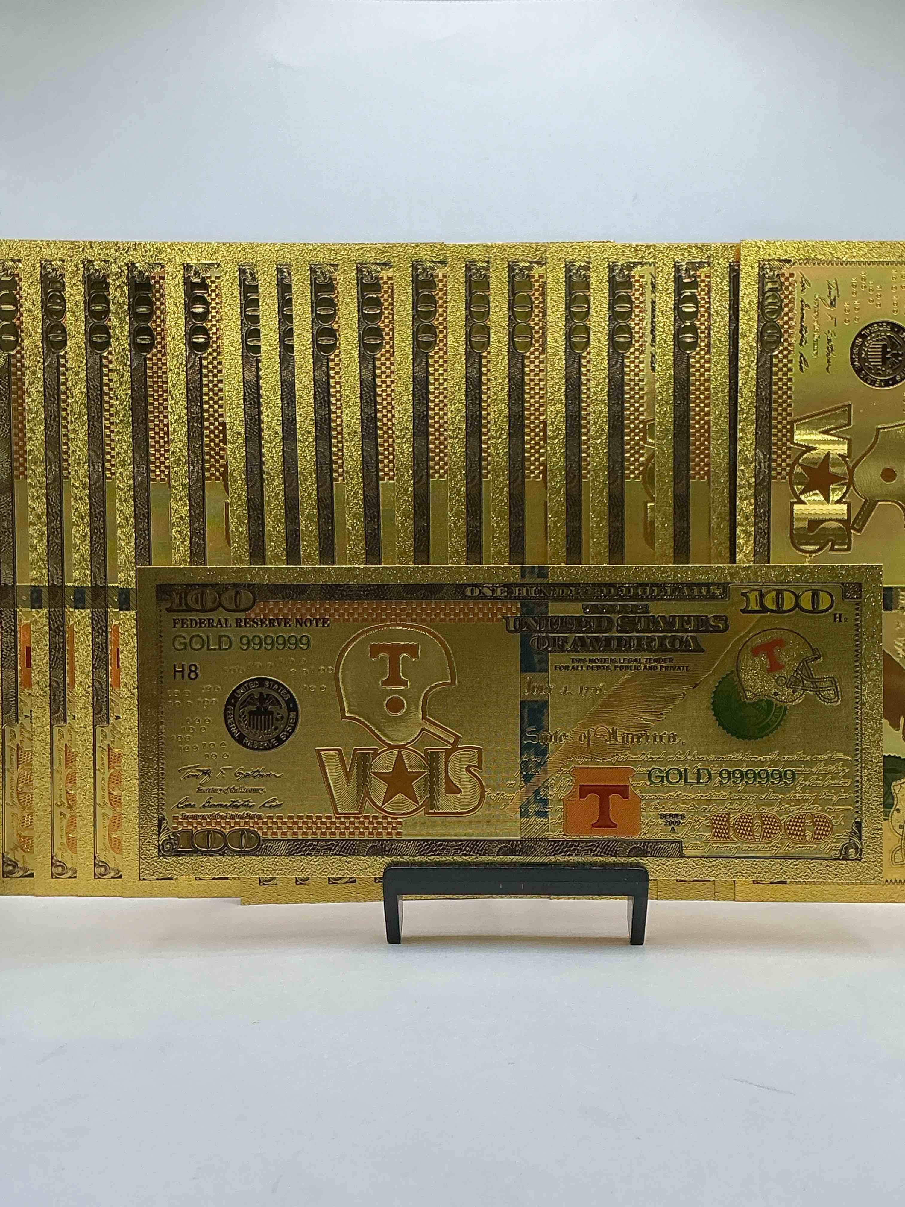 tennessee volunteers collectible memorabilia! super cool, gold in color 100 dollar commemorative university bill! cool designs on front & back of bill! ut fans rejoice, cool memorabilia! plastic bills with cool designs! 