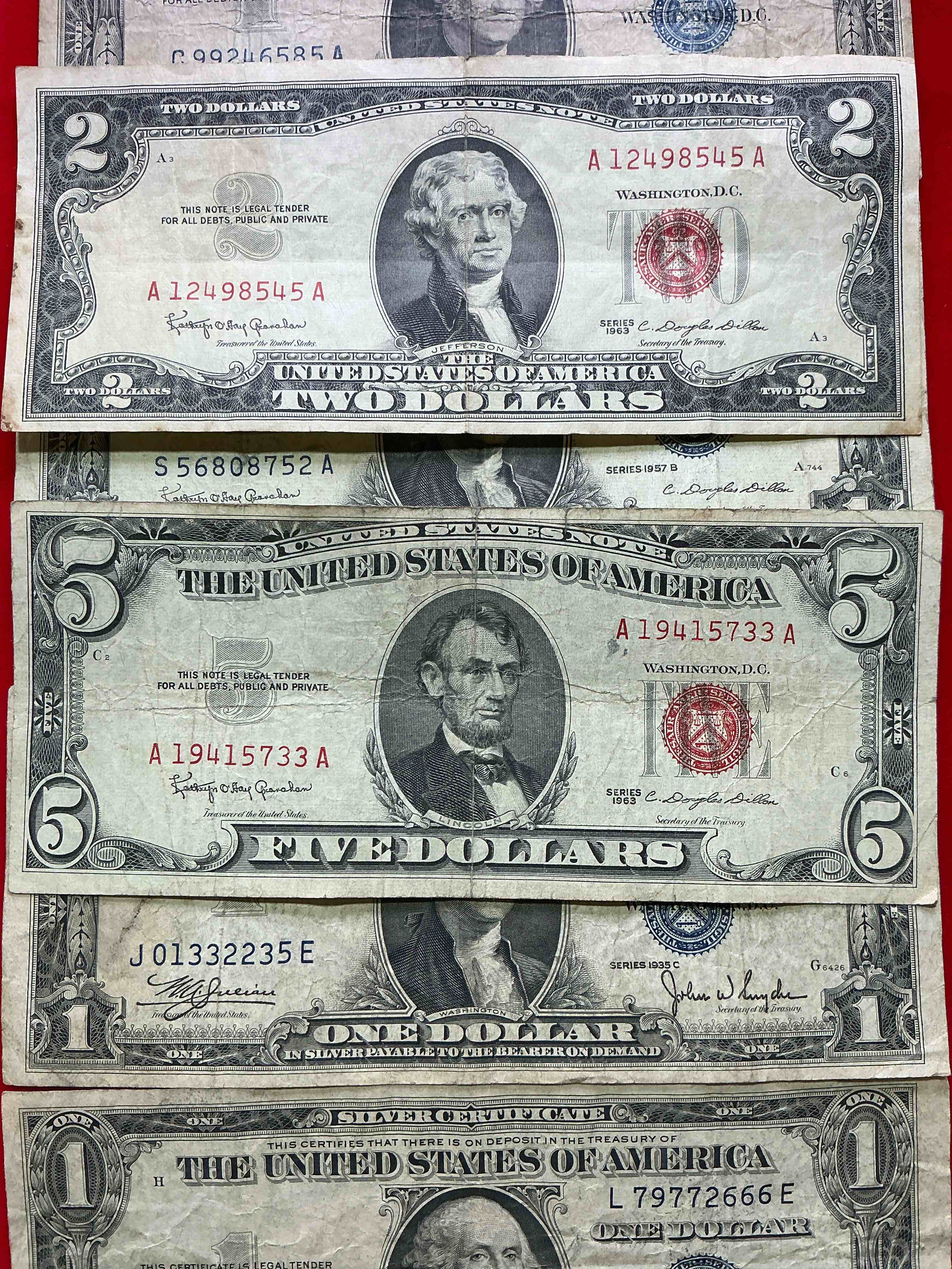 rare american dollar bills! red seal five dollar bill & red seal two dollar bill, along with silver certificates! five dollar bill ultra rare & in good condition, red seal two dollar bill in good condition & silver certificates produced from 1878 to 1964 & are still considered legal tender at face value. here are gorgeous, circulated 1935 & 1957 u.s. one dollar silver certificate, with highly collectible "blue seal!* own an awesome piece of history! american dollar lot! 
