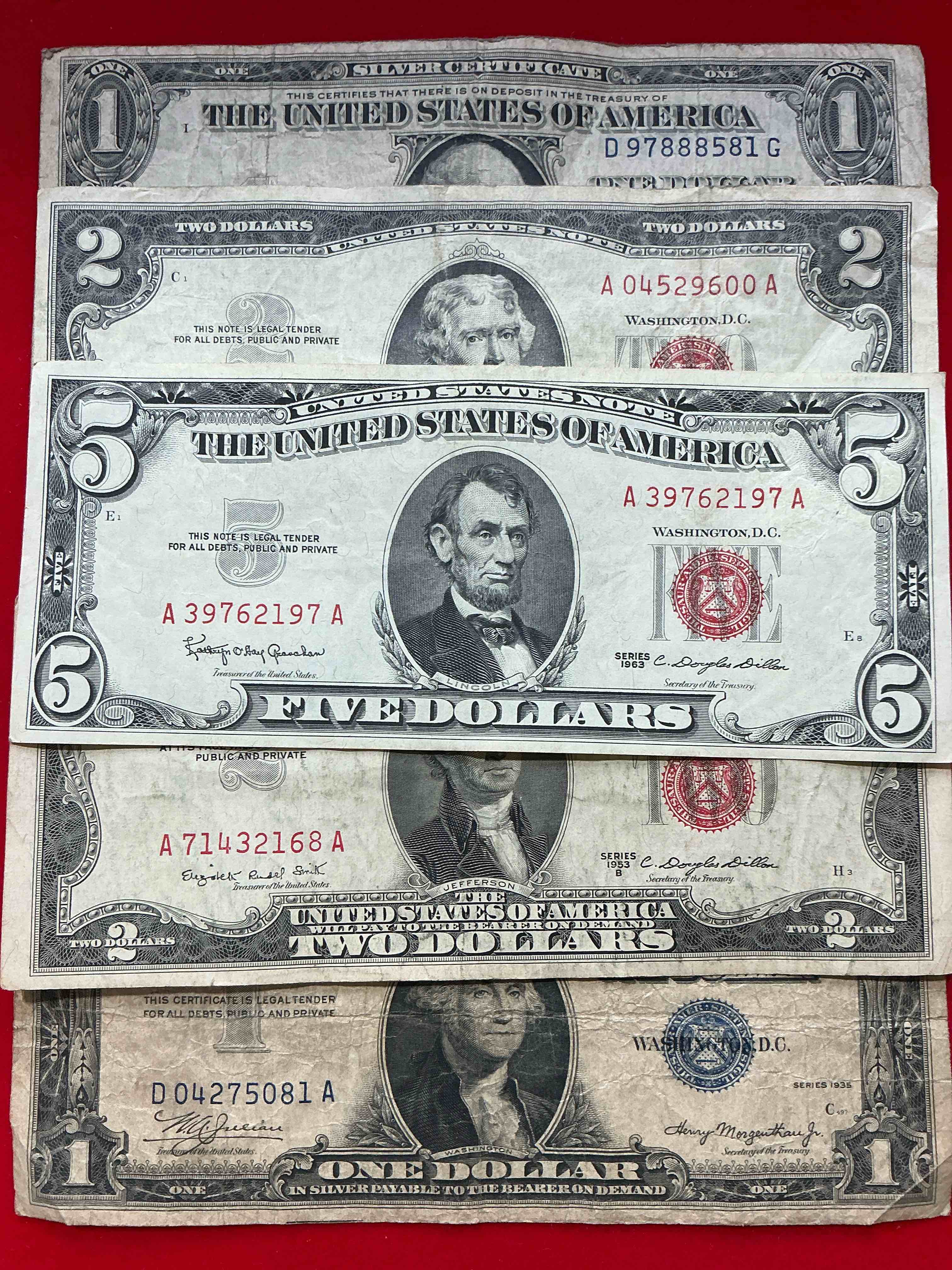 rare american dollar bills! red seal five dollar bill & red seal two dollar bill, along with silver certificates! five dollar bill ultra rare & in good condition, red seal two dollar bill in good condition & silver certificates produced from 1878 to 1964 & are still considered legal tender at face value. here are gorgeous, circulated 1935 & 1957 u.s. one dollar silver certificate, with highly collectible "blue seal!* own an awesome piece of history! american dollar lot! 