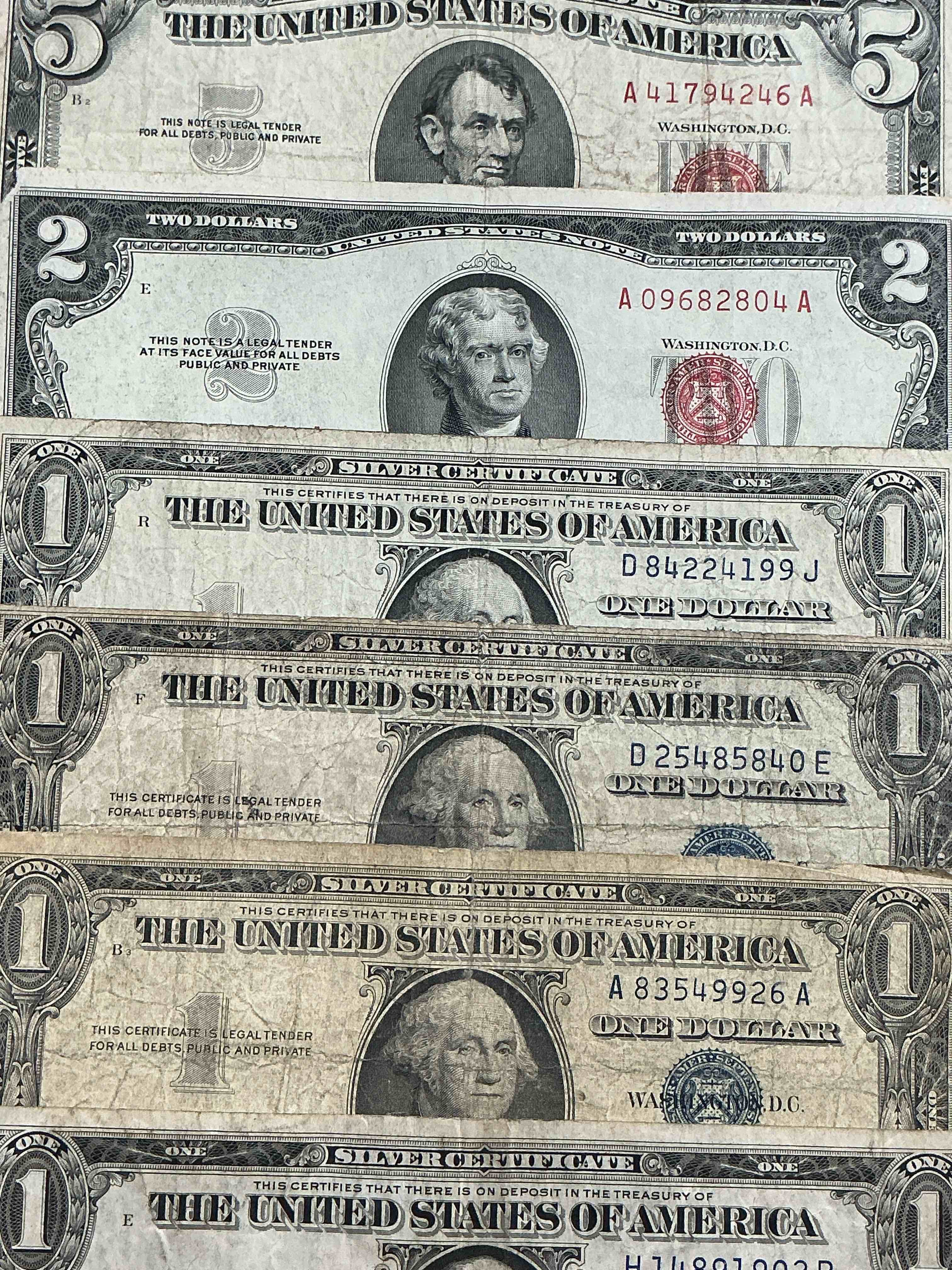Rare American Dollar Bills! RED Seal Five Dollar Bill & Red Seal Two Dollar Bill, Along With Silver Certificates! Five Dollar Bill Ultra Rare & In Good Condition, Red Seal Two Dollar Bill In Good Condition & Silver Certificates Produced From 1878 To 1964 & Are Still Considered Legal Tender At Face Value. Here Are Gorgeous, Circulated 1935 & 1957 U.S. One Dollar Silver Certificate, With Highly Collectible "Blue Seal!* Own An Awesome Piece Of History! American Dollar Lot! 