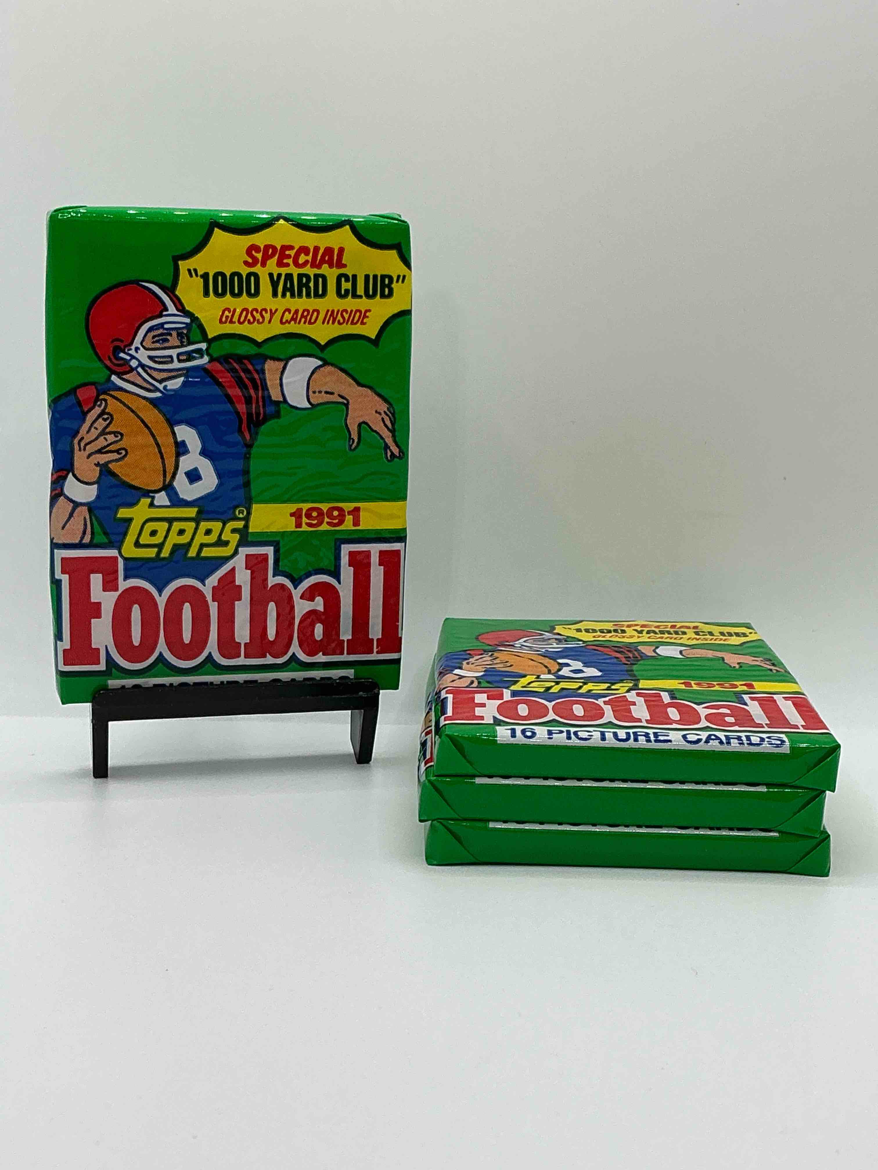 1991 topps football unopened sports card pack, direct from original retail case. search for early barry sanders, emmitt smith, jerry rice & joe montana!