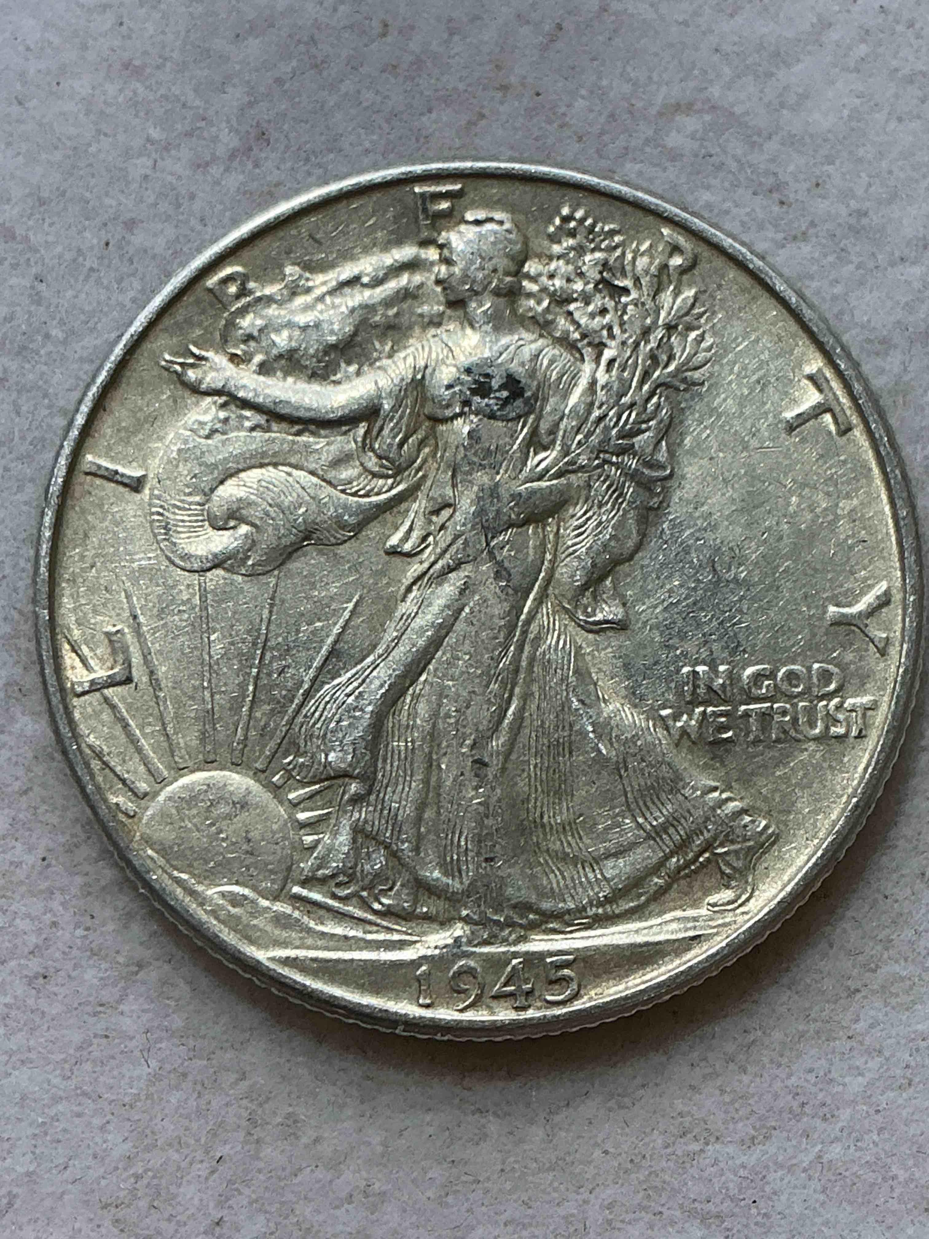 World War II Era Silver! Antique U.S. Silver! Liberty Walking Silver Fine U.S. Silver Half Dollar! This Striking Half Dollars Were Minted From 1916-1947 & Have Become Some Of The Most Collectible Coins In History! Here Is A Striking Appears Uncirculated Example From 1945! Liberty Walking Coins Are 90% Fine U.S. Silver, A Great Investment In Precious Metal!