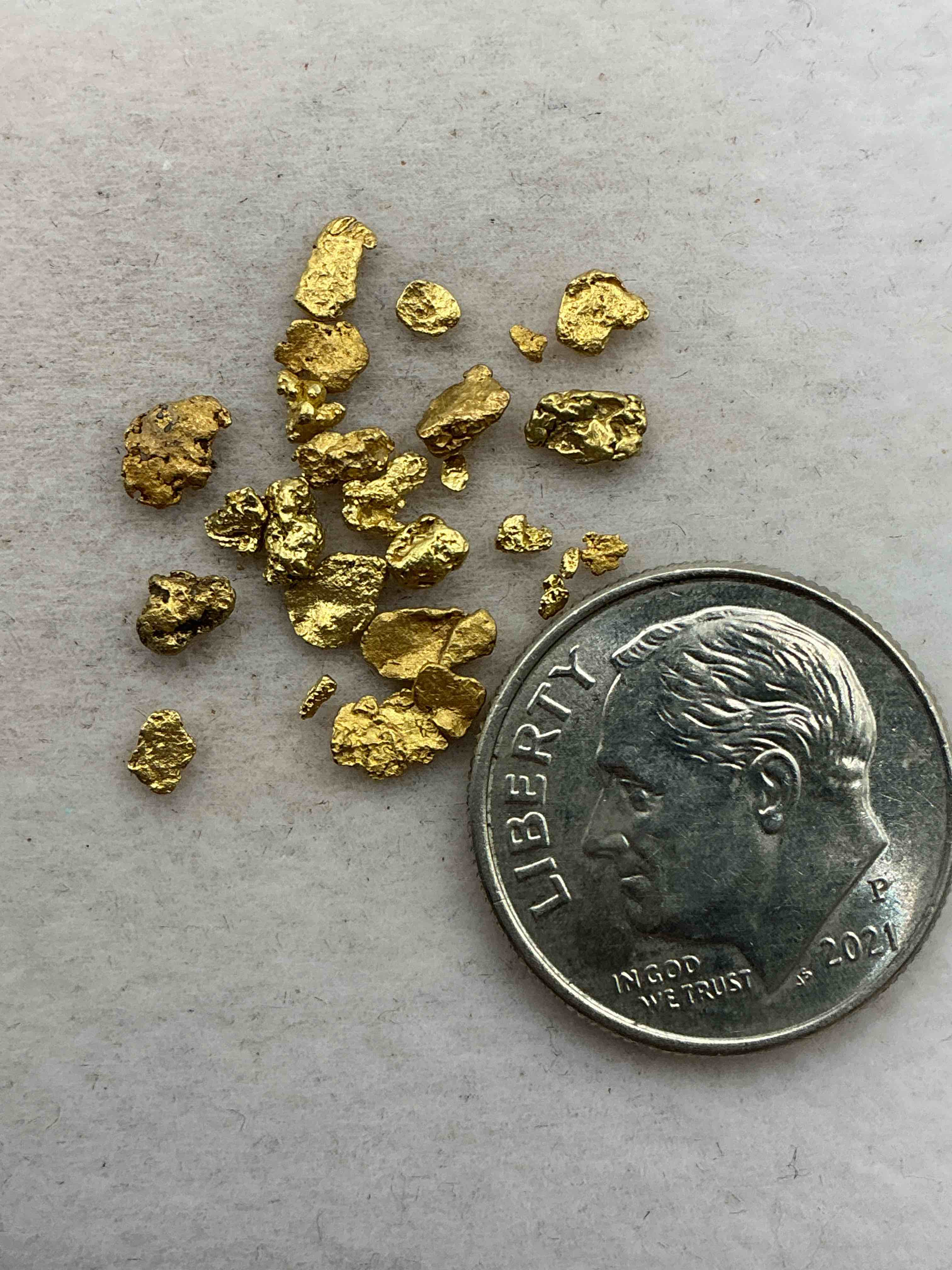 Condition photo showing Good Condition for one gram total genuine gold nuggets! gold nuggets fresh from prospecting north carolina mountains, total weight of all nuggets is approximately one gram. these gold nuggets typically test at between approx 22-24 karat. gold in raw, prospected form is extremely hard to find & much rarer than any refined form. get in on the gold craze... gold has increased in value over 40% since 2025! u.s. dime for size reference only (not included). gold vile in image included. own genuine, gold nuggets! 