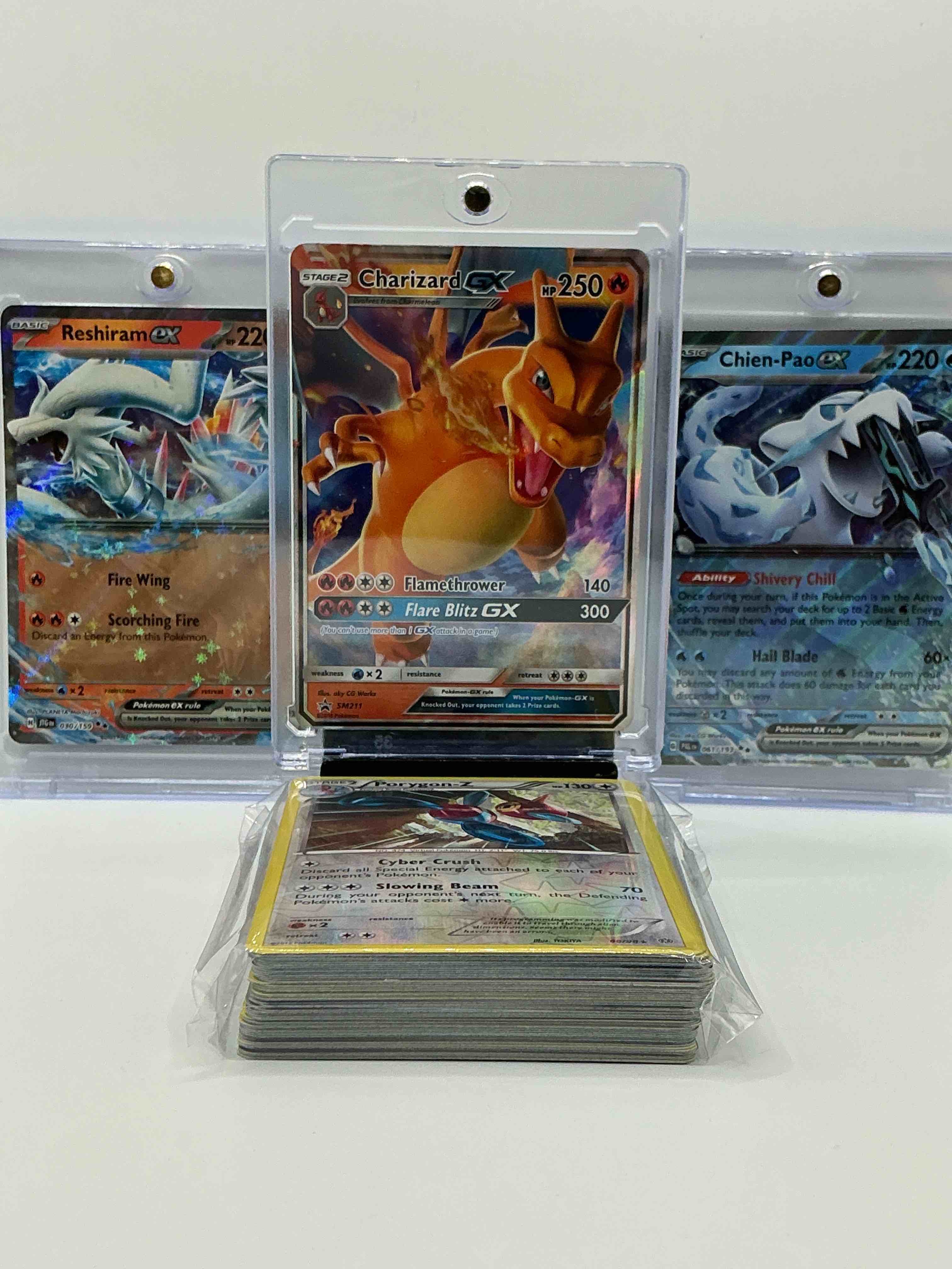 Condition photo showing New/Like New for charizard gx & reshiram ex! insane! along with 50 other pokémon heroes, holos, legends & commons- including holographic cards, stage 2 cards, holos in all forms & more! also includes 36 non holo common/ uncommon basic & first stage cards trainers & energy too! perfect set for collectors & enthusiasts!