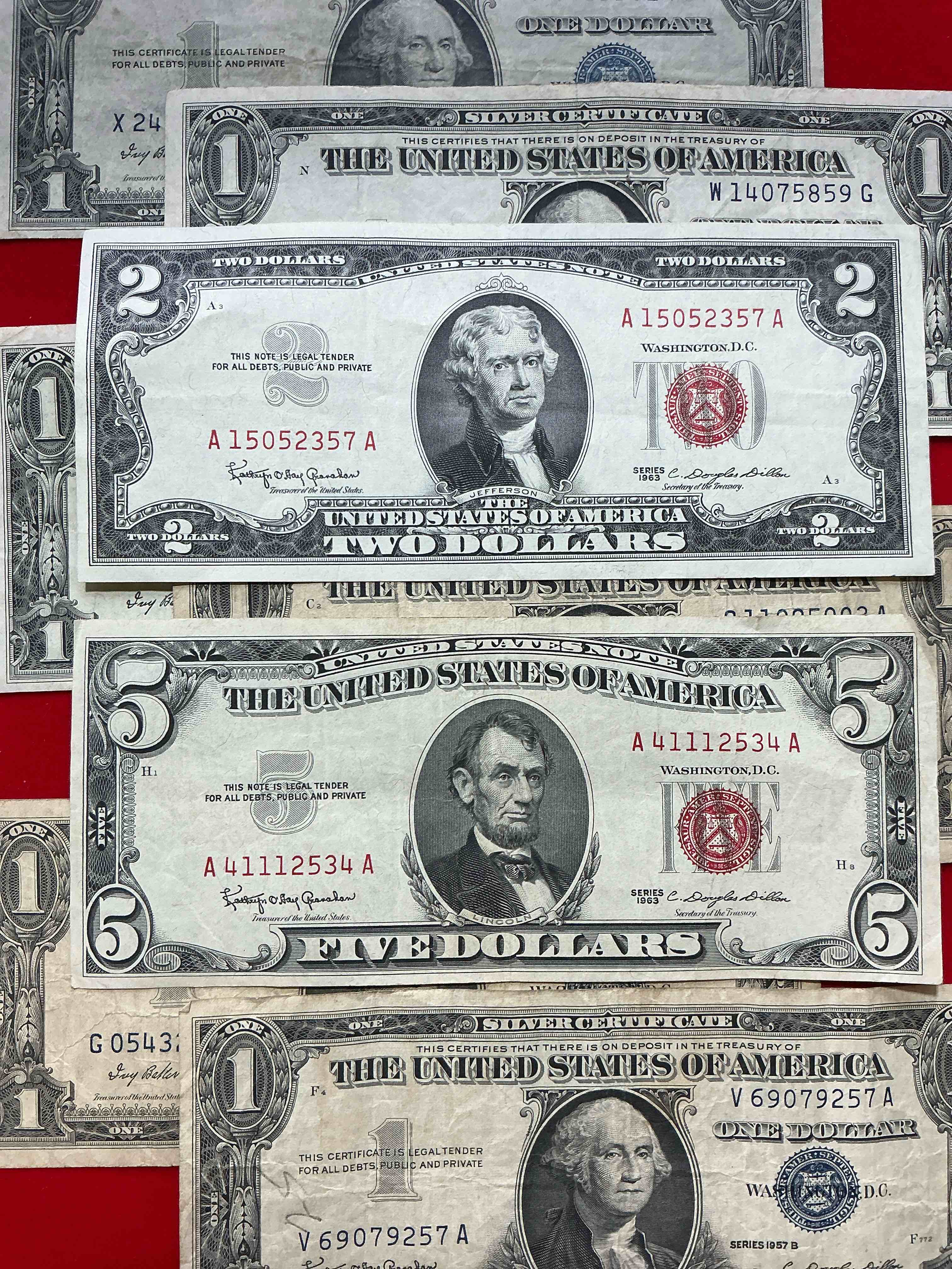 rare american dollar bills! red seal five dollar bill & red seal two dollar bill, along with silver certificates! five dollar bill ultra rare & in good condition, red seal two dollar bill in good condition & silver certificates produced from 1878 to 1964 & are still considered legal tender at face value. here are gorgeous, circulated 1935 & 1957 u.s. one dollar silver certificate, with highly collectible "blue seal!* own an awesome piece of history! american dollar lot! 