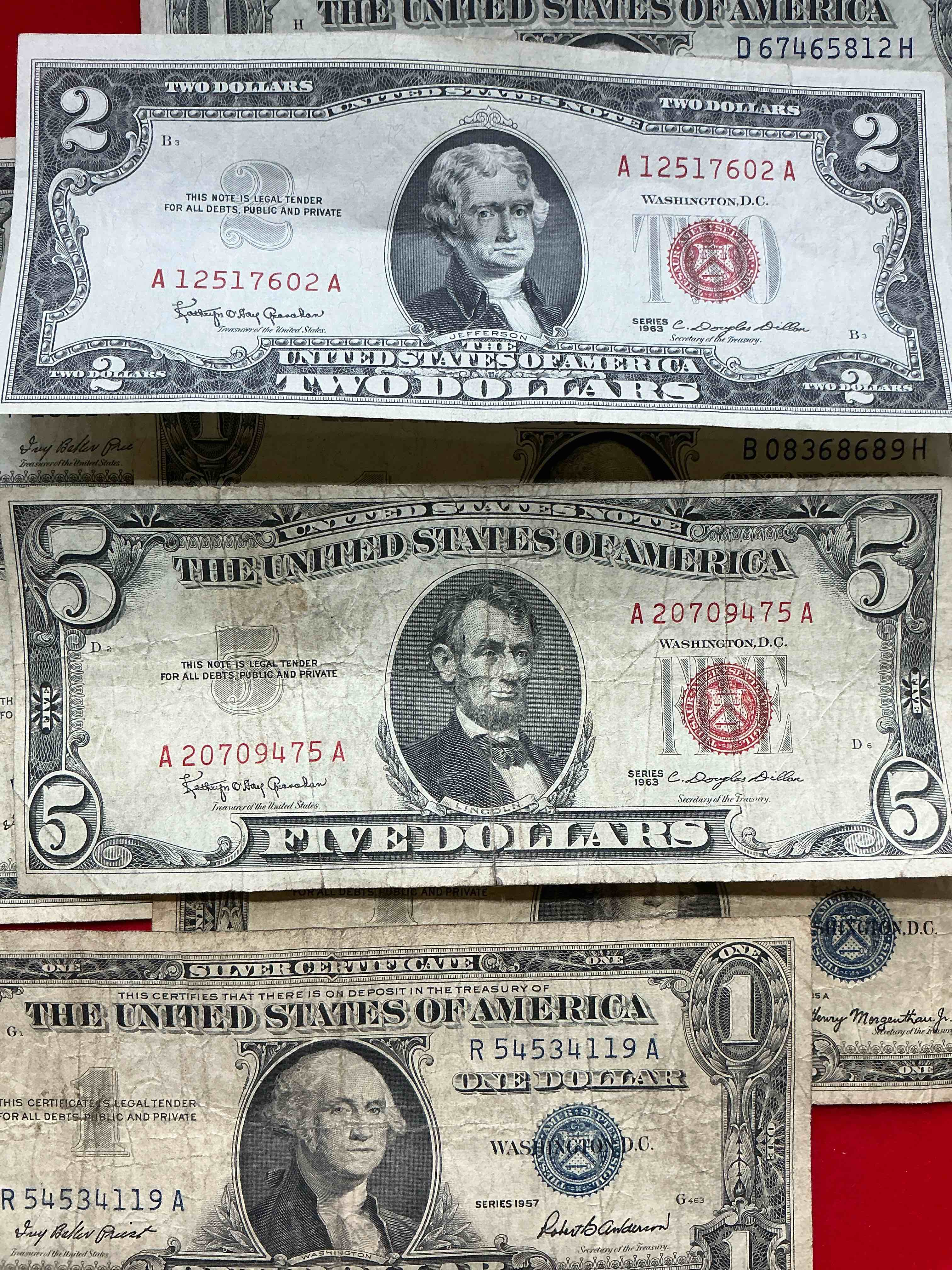 rare american dollar bills! red seal five dollar bill & red seal two dollar bill, along with silver certificates! five dollar bill ultra rare & in good condition, red seal two dollar bill in good condition & silver certificates produced from 1878 to 1964 & are still considered legal tender at face value. here are gorgeous, circulated 1935 & 1957 u.s. one dollar silver certificate, with highly collectible "blue seal!* own an awesome piece of history! american dollar lot! 