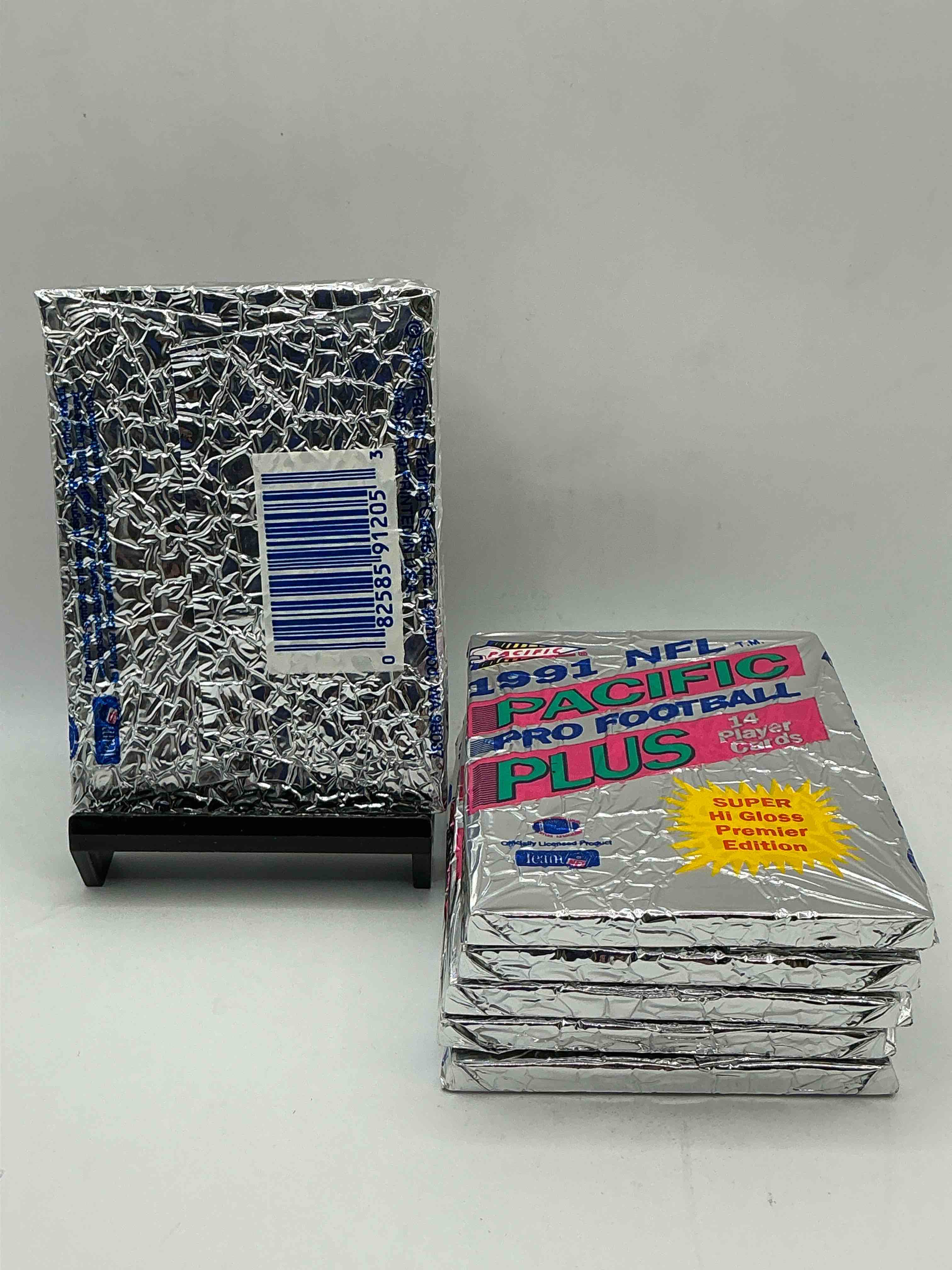 Condition photo showing New/Like New for 1991 pacific football, something you hardly ever see! pacific footbell sealed card pack, direct from original retail case. search for brett favre rookie, barry sanders, jerry rice & so much more! hard to find!