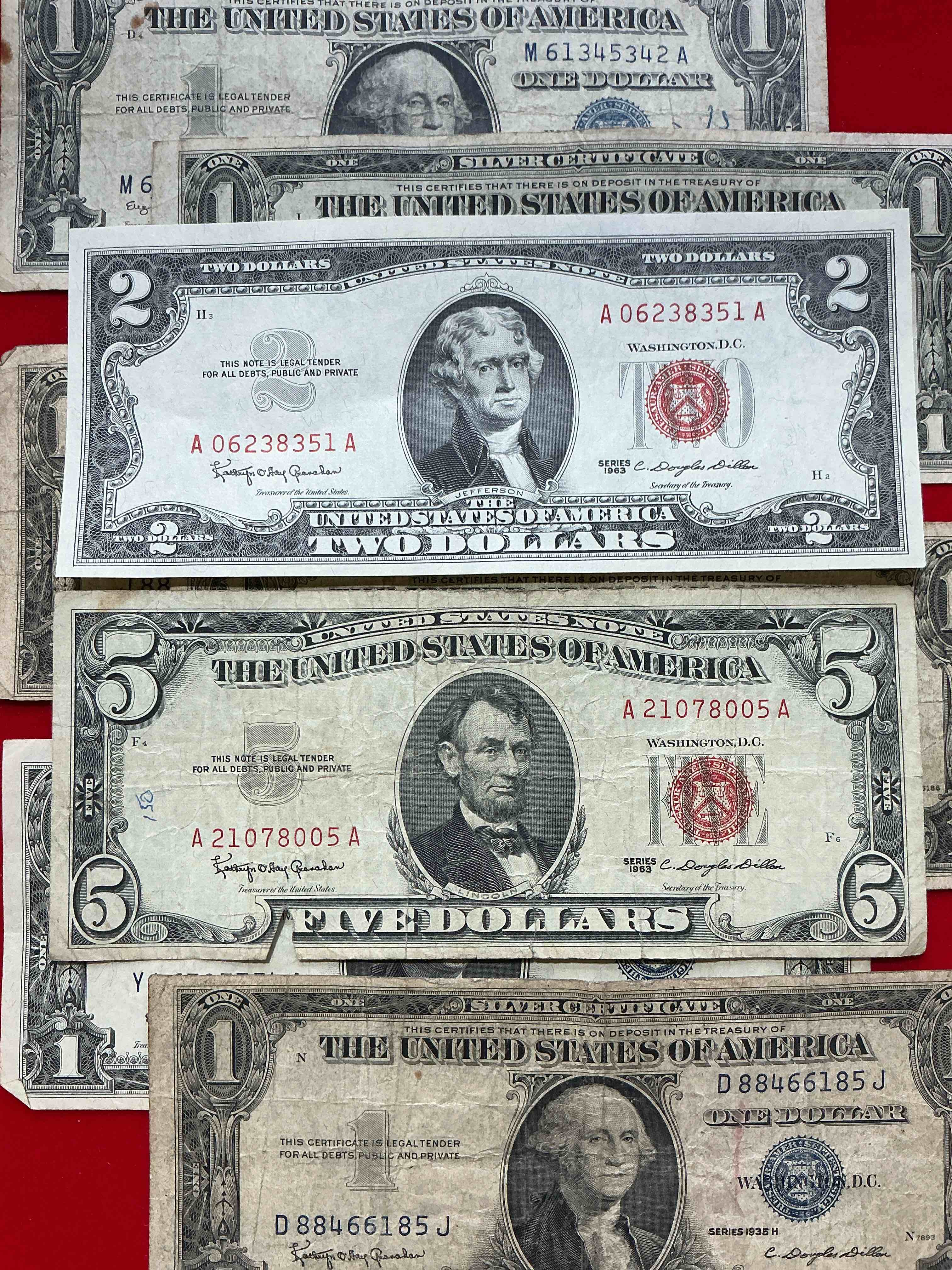 rare american dollar bills! red seal five dollar bill & red seal two dollar bill, along with silver certificates! five dollar bill ultra rare & in good condition, red seal two dollar bill in good condition & silver certificates produced from 1878 to 1964 & are still considered legal tender at face value. here are gorgeous, circulated 1935 & 1957 u.s. one dollar silver certificate, with highly collectible "blue seal!* own an awesome piece of history! american dollar lot! 