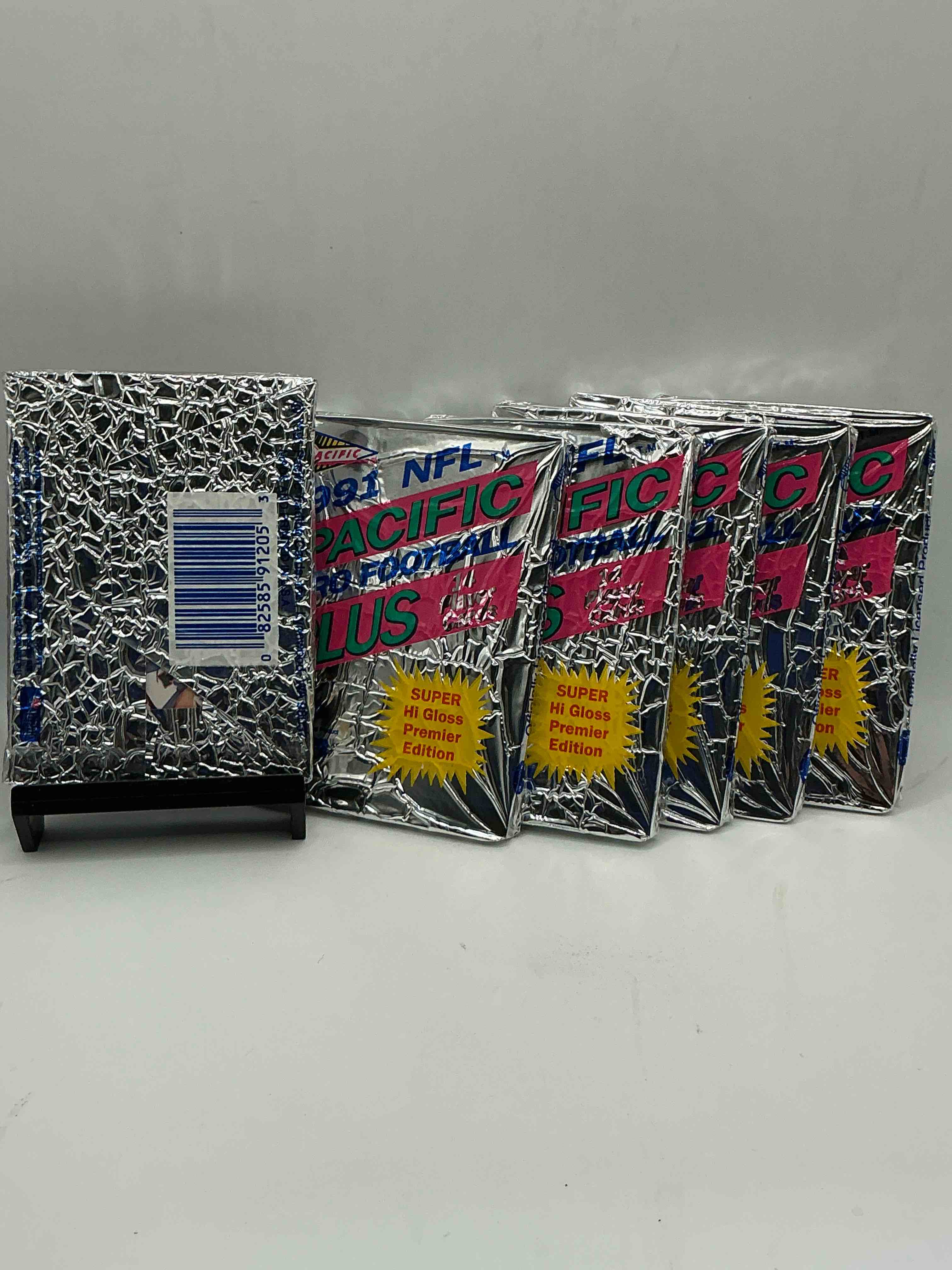 Condition photo showing New/Like New for 1991 pacific football, something you hardly ever see! pacific footbell sealed card pack, direct from original retail case. search for brett favre rookie, barry sanders, jerry rice & so much more! hard to find!