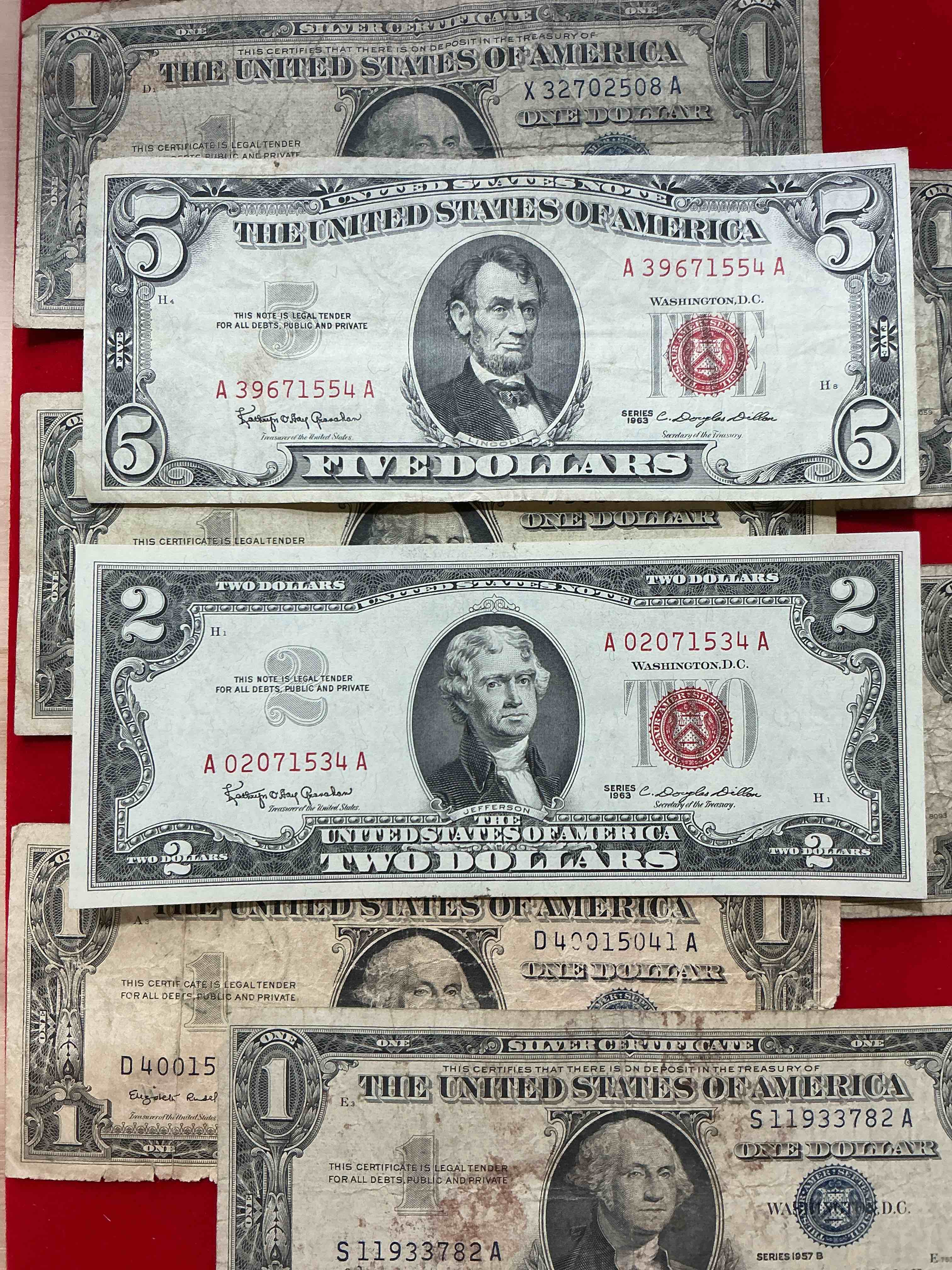 rare american dollar bills! red seal five dollar bill & red seal two dollar bill, along with silver certificates! five dollar bill ultra rare & in good condition, red seal two dollar bill in good condition & silver certificates produced from 1878 to 1964 & are still considered legal tender at face value. here are gorgeous, circulated 1935 & 1957 u.s. one dollar silver certificate, with highly collectible "blue seal!* own an awesome piece of history! american dollar lot! 