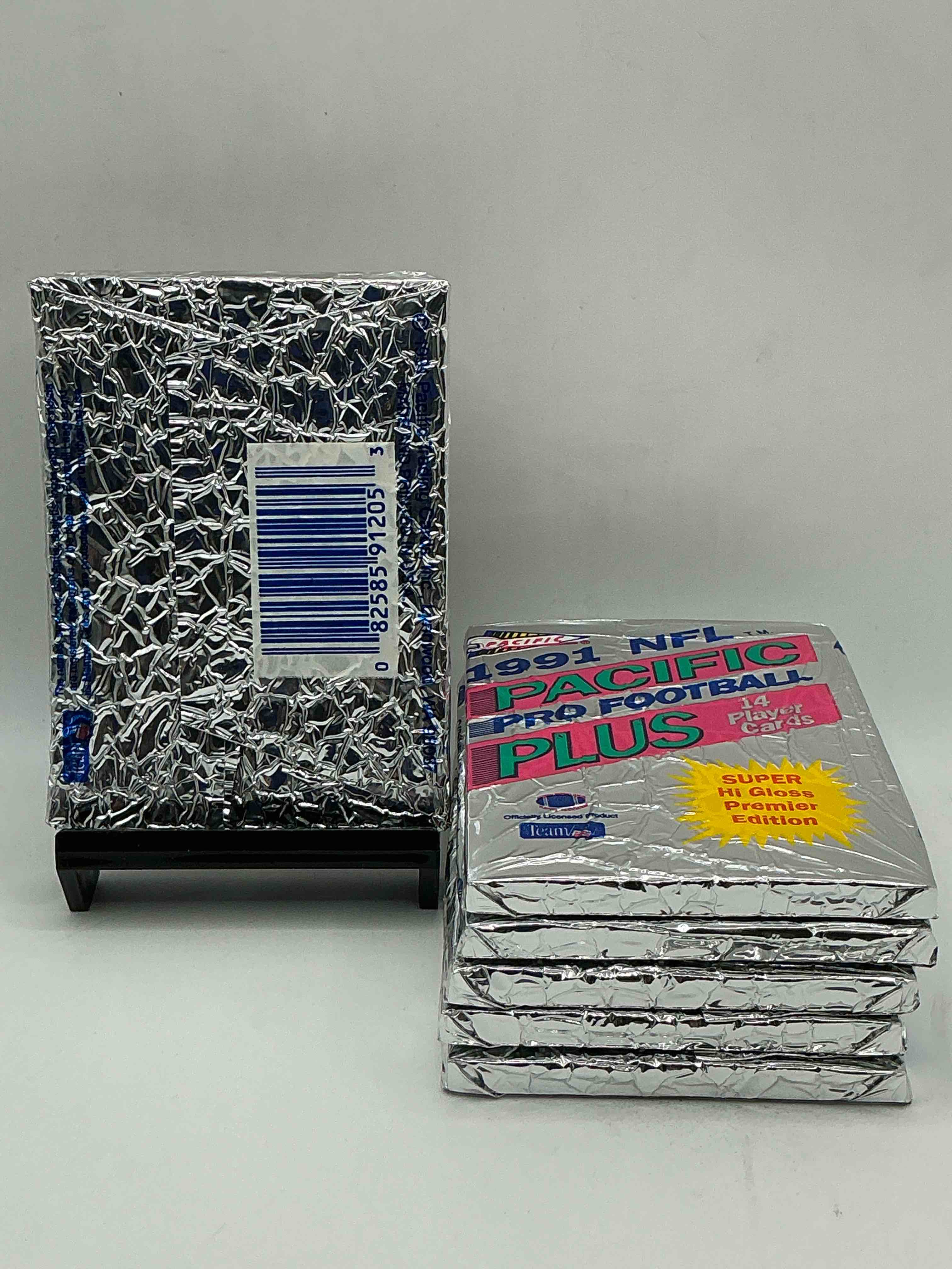 Condition photo showing New/Like New for 1991 pacific football, something you hardly ever see! pacific footbell sealed card pack, direct from original retail case. search for brett favre rookie, barry sanders, jerry rice & so much more! hard to find!