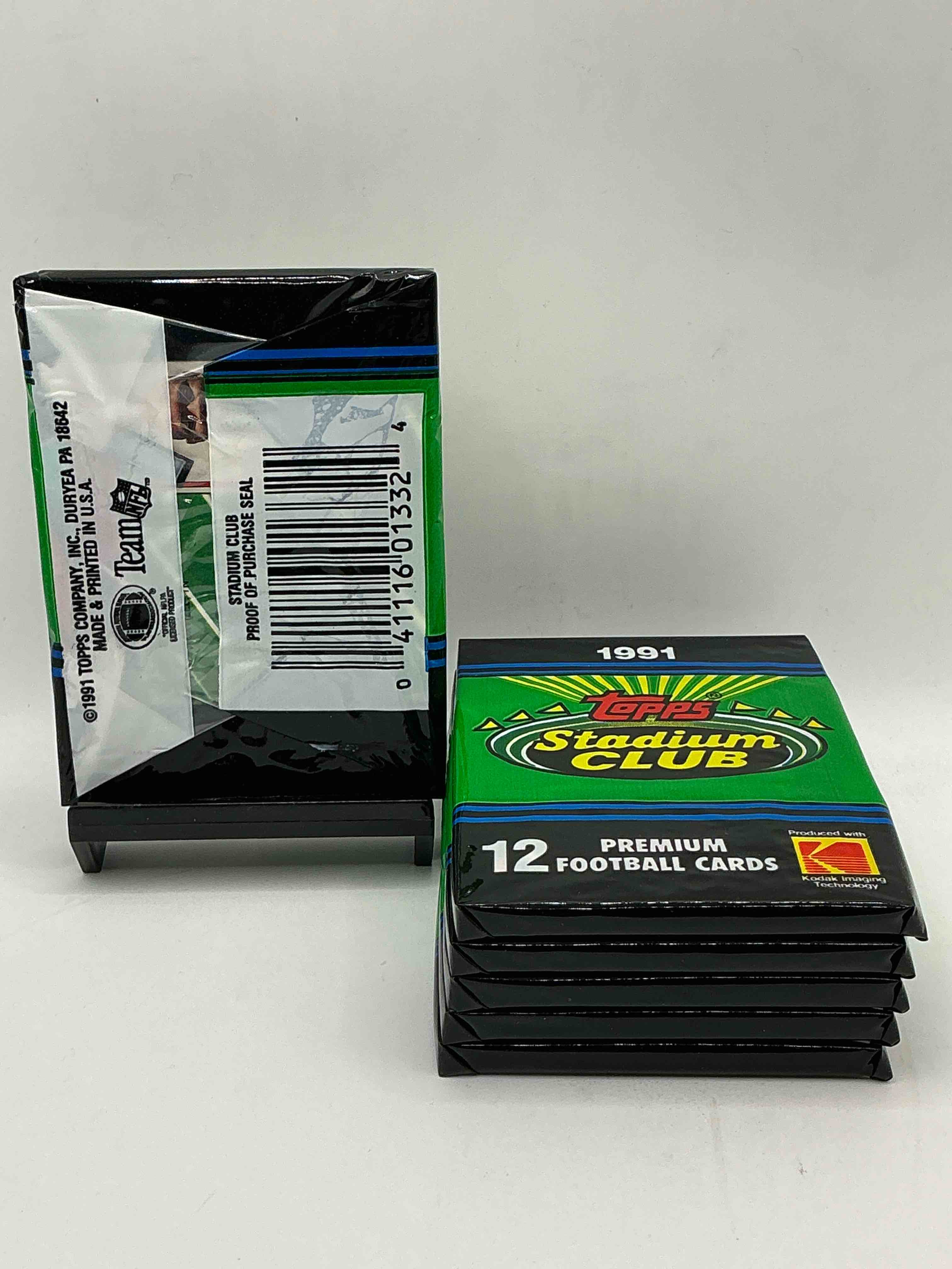 Condition photo showing New/Like New for 1991 topps stadium club football unopened sports card pack, direct from original retail case. search for early barry sanders, emmitt smith, jerry rice & joe montana!