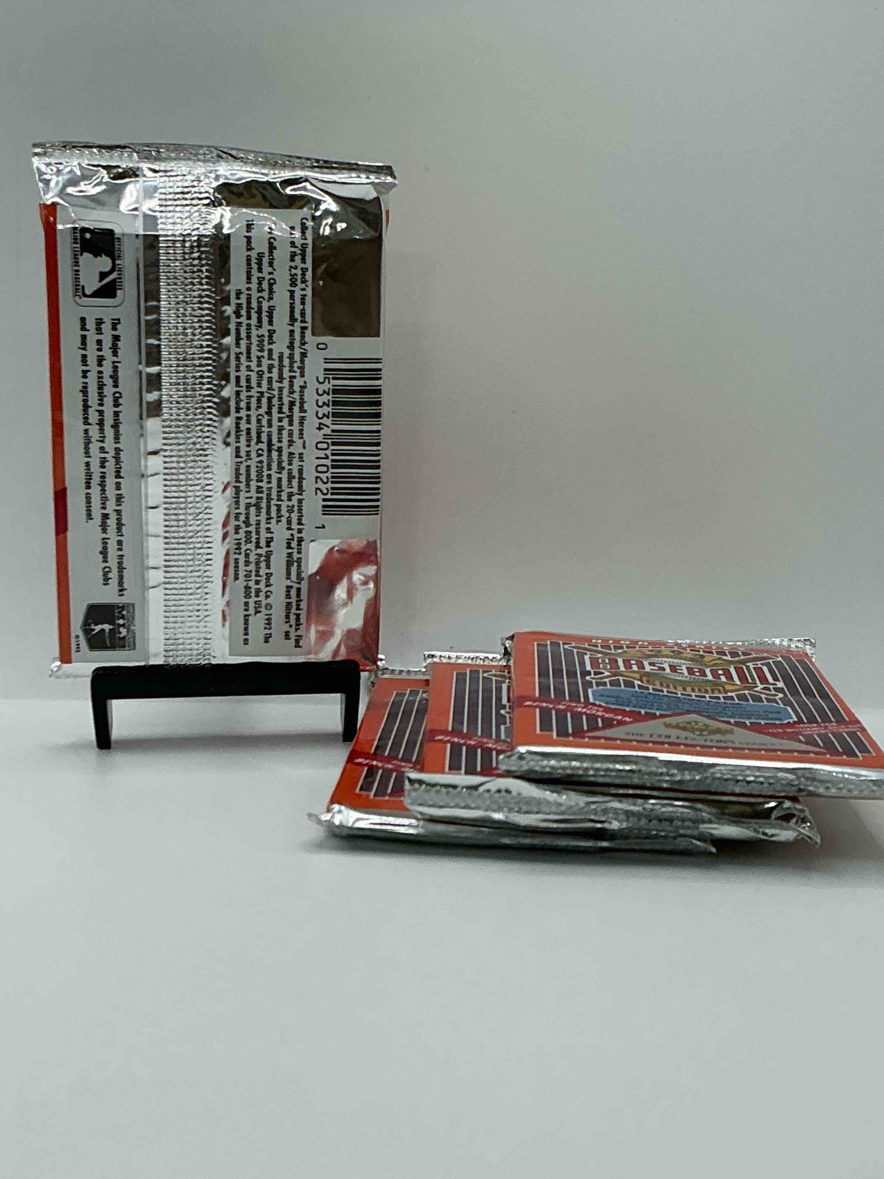 Condition photo showing New/Like New for 1992 high series upper deck baseball sealed sports & collectible card pack, direct from original sealed retail case! search for ultra rare & valuable ted williams & johnny bench signed insert cards as well as deion sanders, ken griffey jr., nolan ryan & so much more!