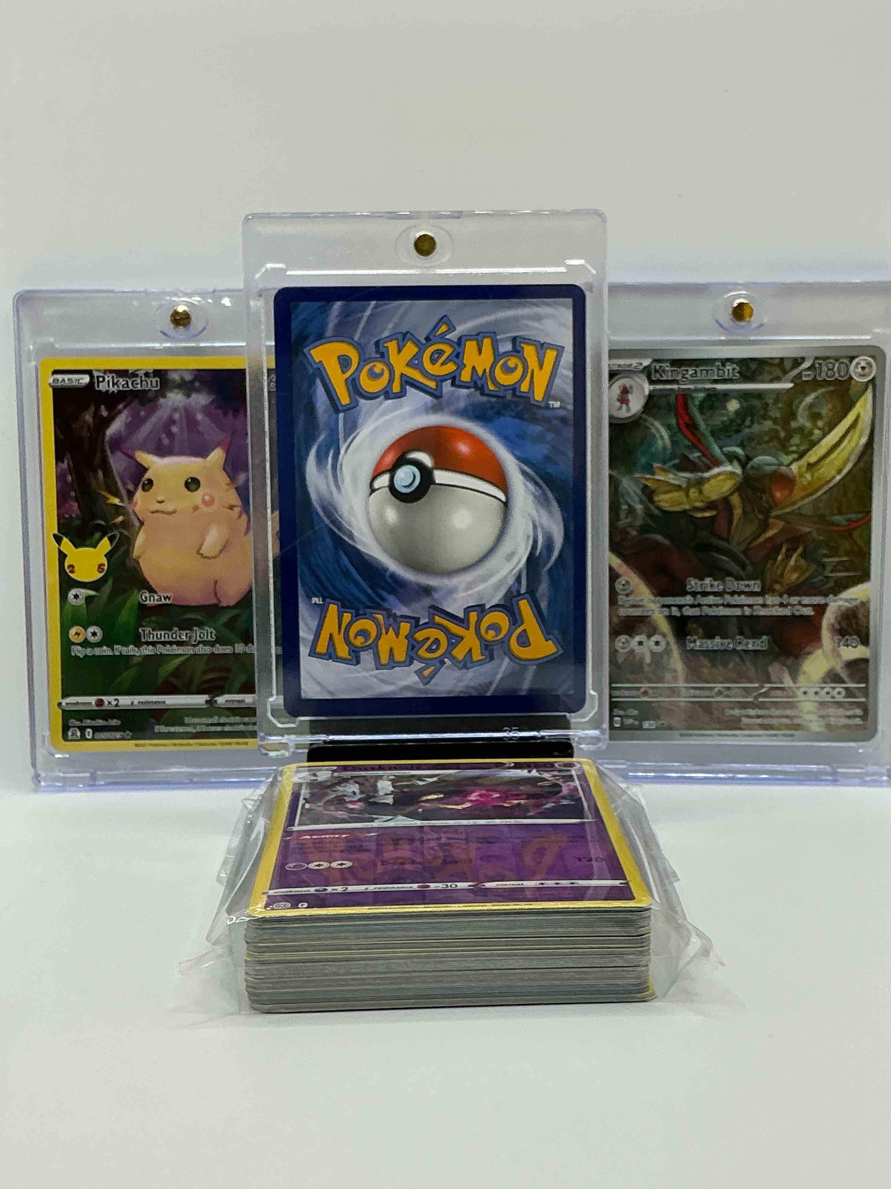 Condition photo showing New/Like New for charizard gx, kingambit full art & pikachu full art! wow! along with 50 other pokémon heroes, holos, legends & commons- including holographic cards, stage 2 cards, holos in all forms & more! also includes 36 non holo common/ uncommon basic & first stage cards trainers & energy too! perfect set for collectors & enthusiasts!