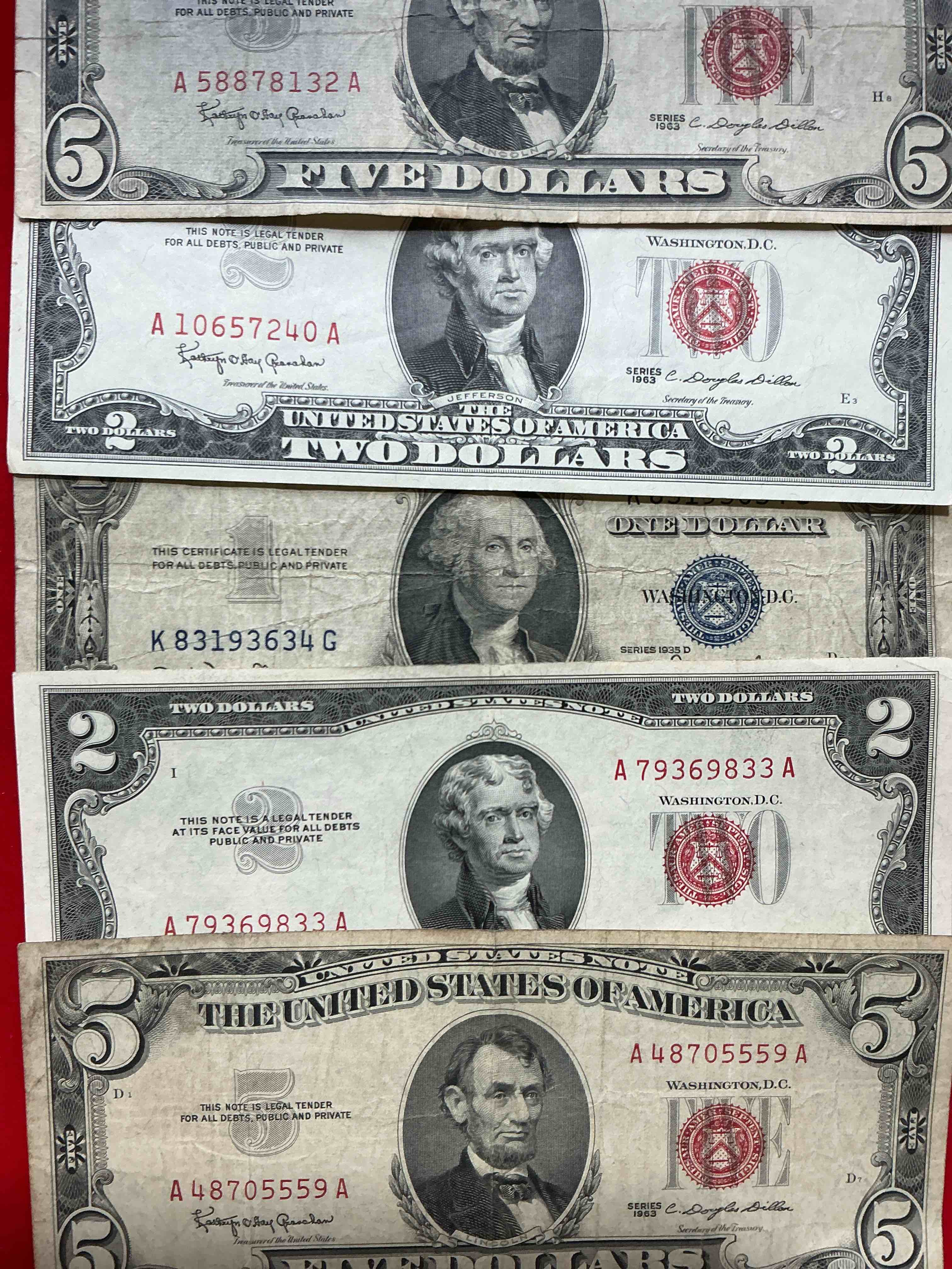 rare american dollar bills! red seal five dollar bill & red seal two dollar bill, along with silver certificates! five dollar bill ultra rare & in good condition, red seal two dollar bill in good condition & silver certificates produced from 1878 to 1964 & are still considered legal tender at face value. here are gorgeous, circulated 1935 & 1957 u.s. one dollar silver certificate, with highly collectible "blue seal!* own an awesome piece of history! american dollar lot! 