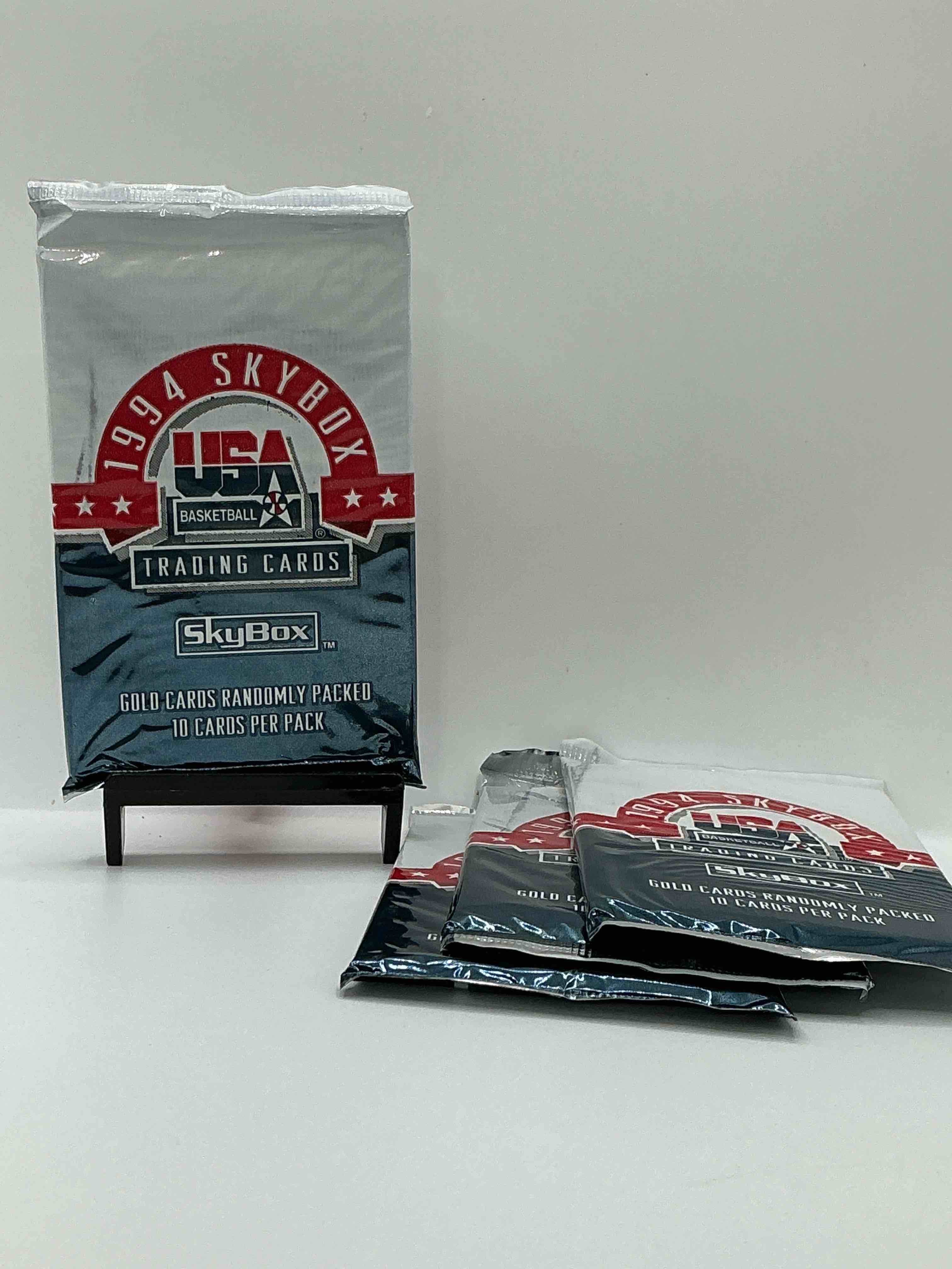 1994 usa basketball gold! here's a rare chance to get sealed usa nba basketball card packs, direct from original retail case! 1994 nba skybox sealed card packs, dream team fans here it is! shaq, isiah thomas, reggie miller & so much more! search for randomly inserted valuable gold cards. hard to find awesome sports card memorabilia, go usa!