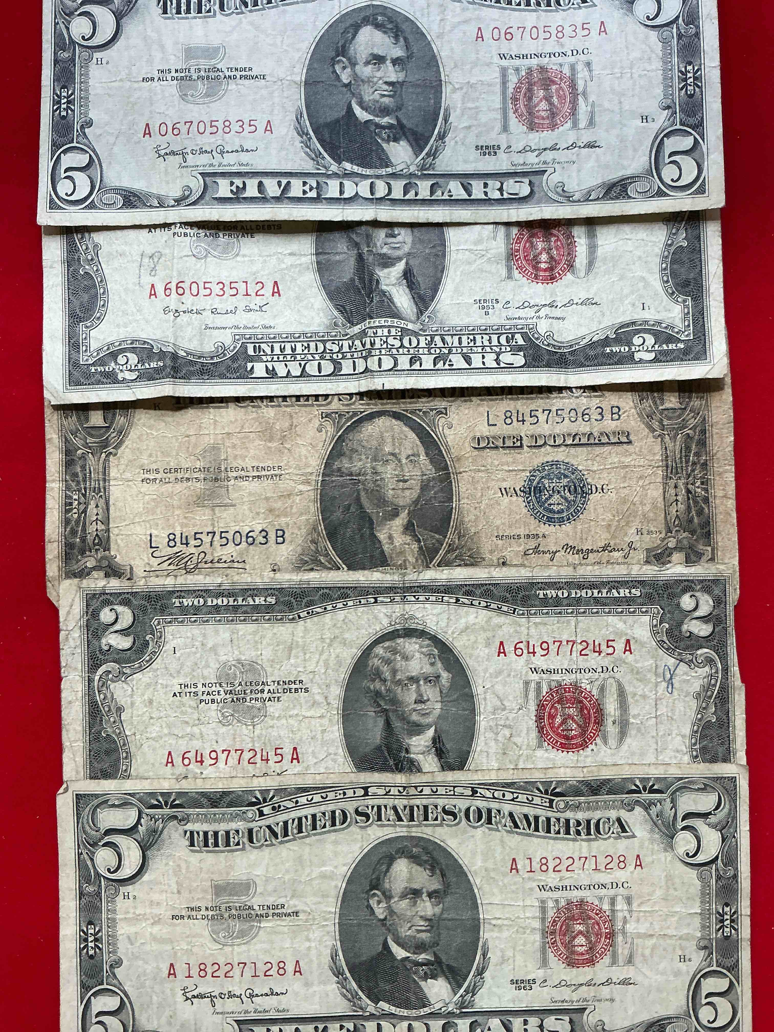rare american dollar bills! red seal five dollar bill & red seal two dollar bill, along with silver certificates! five dollar bill ultra rare & in good condition, red seal two dollar bill in good condition & silver certificates produced from 1878 to 1964 & are still considered legal tender at face value. here are gorgeous, circulated 1935 & 1957 u.s. one dollar silver certificate, with highly collectible "blue seal!* own an awesome piece of history! american dollar lot! 