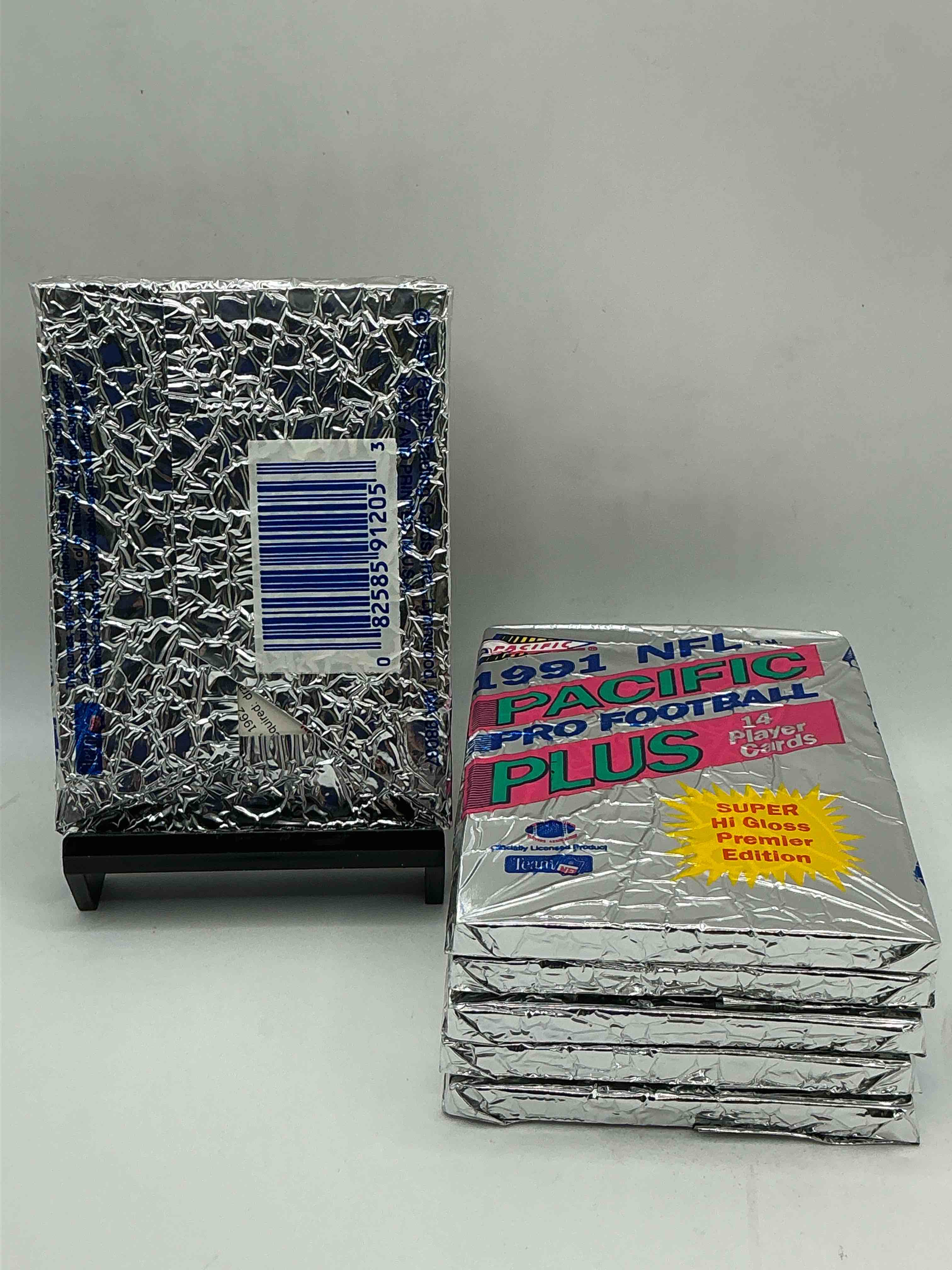 Condition photo showing New/Like New for 1991 pacific football, something you hardly ever see! pacific footbell sealed card pack, direct from original retail case. search for brett favre rookie, barry sanders, jerry rice & so much more! hard to find!