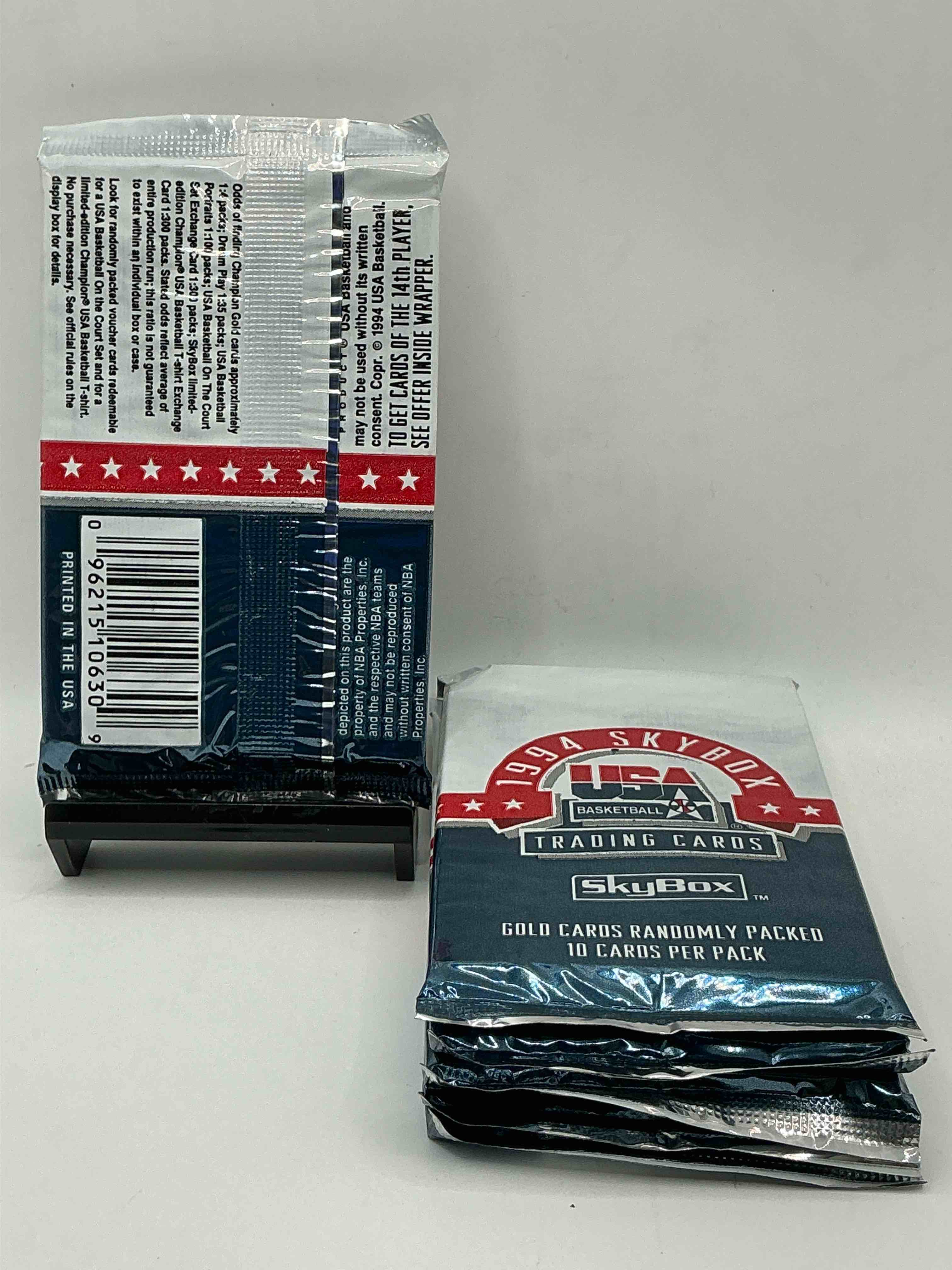 Condition photo showing New/Like New for 1994 usa basketball gold! here's a rare chance to get sealed usa nba basketball card packs, direct from original retail case! 1994 nba skybox sealed card packs, dream team fans here it is! shaq, isiah thomas, reggie miller & so much more! search for randomly inserted valuable gold cards. hard to find awesome sports card memorabilia, go usa!