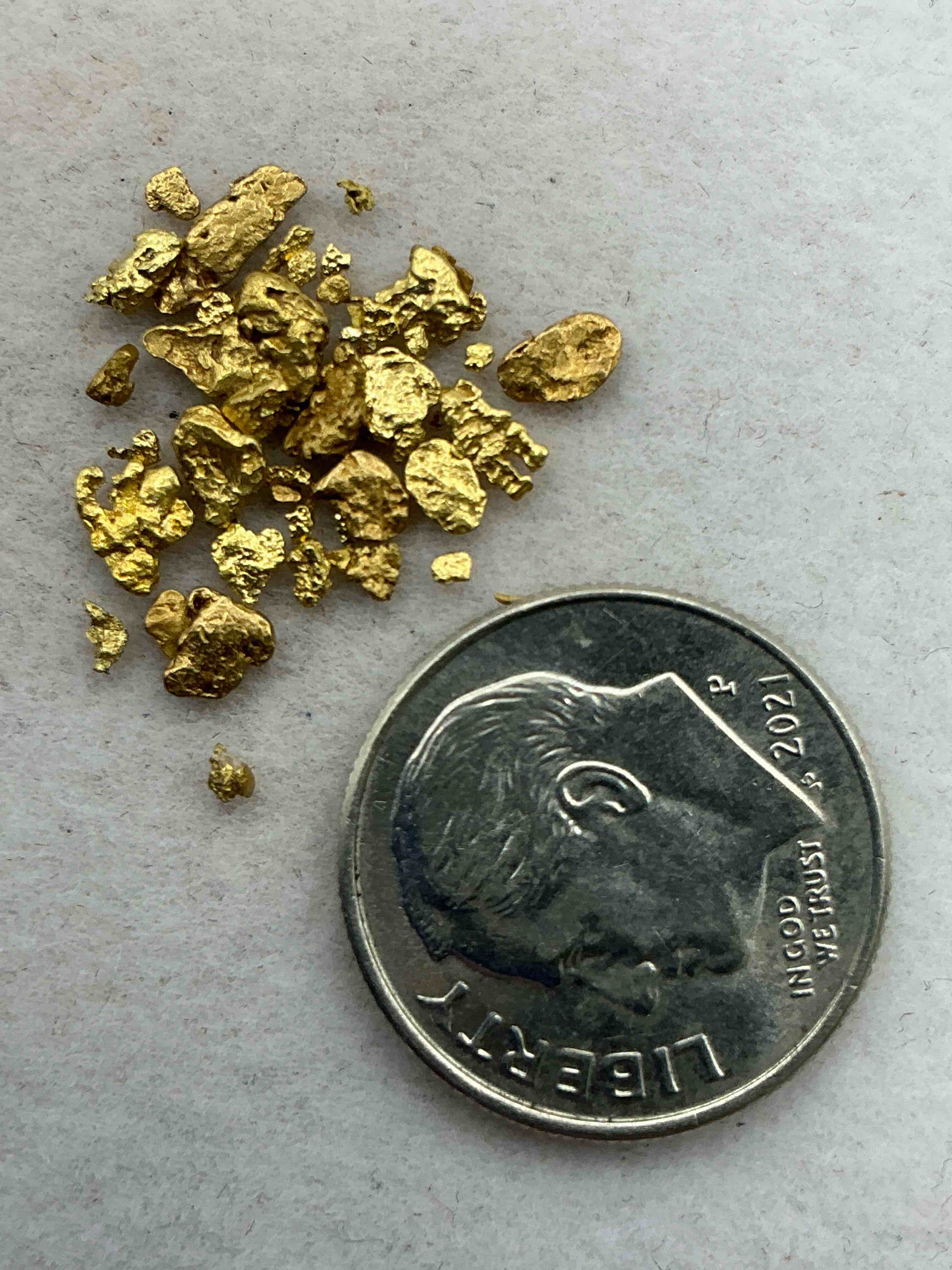 Condition photo showing Good Condition for approximately 1 gram of genuine gold nuggets! gold nuggets fresh from prospecting north carolina mountains, total weight of all nuggets is approximately 1 gram! these gold nuggets test at between approx 22-24 karat. gold in raw, prospected form is extremely hard to find & much rarer than any refined form. get in on the gold craze... gold has increased in value over 40% since 2025! u.s. dime for size reference only (not included). case in image included. own genuine, gold nuggets!