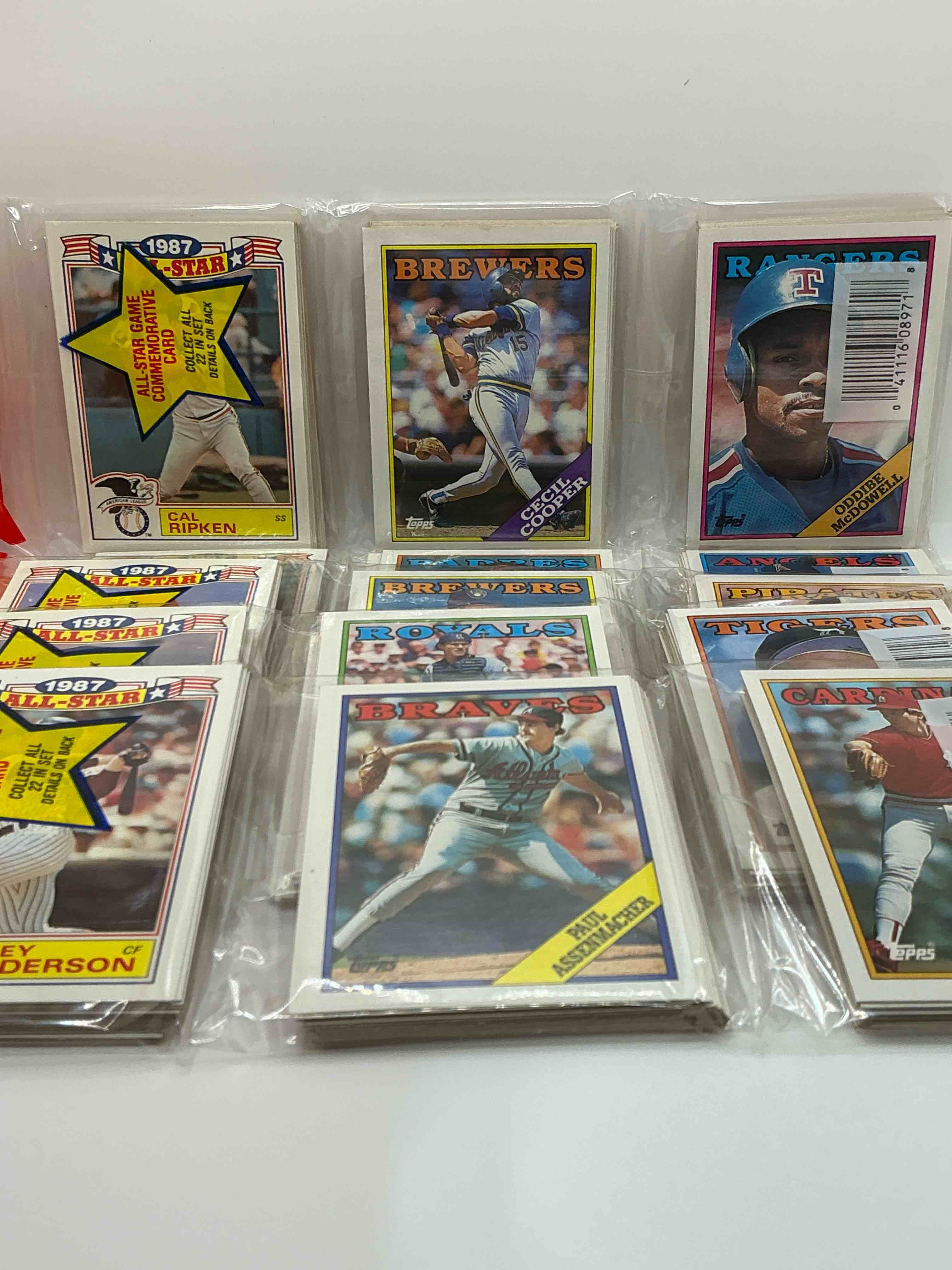 Condition photo showing New/Like New for rickey henderson showing on top! rare rack packs! 80's baseball fan's rejoice! 1988 topps baseball unopened rack packs full of collectible trading cards! search for valuable don mattingly "world of baseball" & nolan ryan cards worth hundreds in perfect condition!