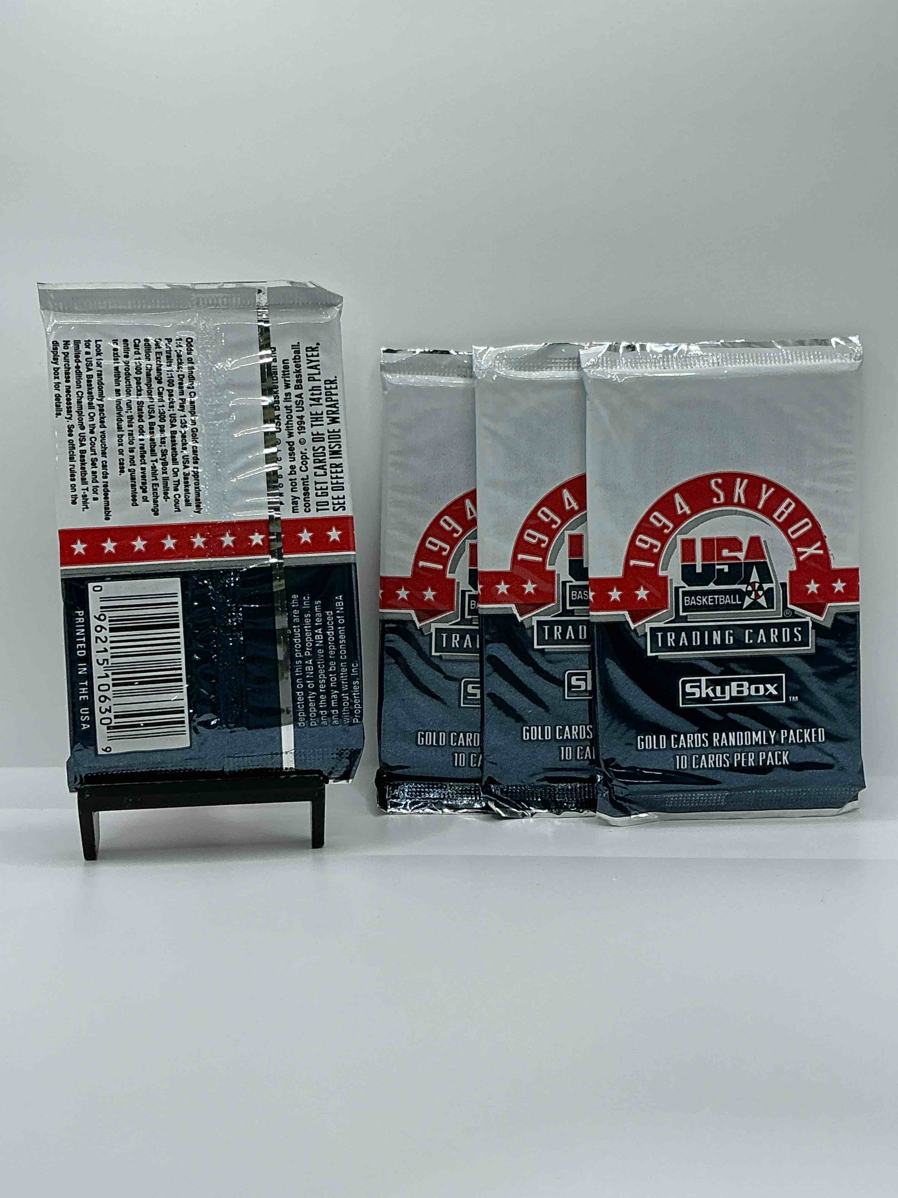 Condition photo showing New/Like New for 1994 usa basketball gold! here's a rare chance to get sealed usa nba basketball card packs, direct from original retail case! 1994 nba skybox sealed card packs, dream team fans here it is! shaq, isiah thomas, reggie miller & so much more! search for randomly inserted valuable gold cards. hard to find awesome sports card memorabilia, go usa!