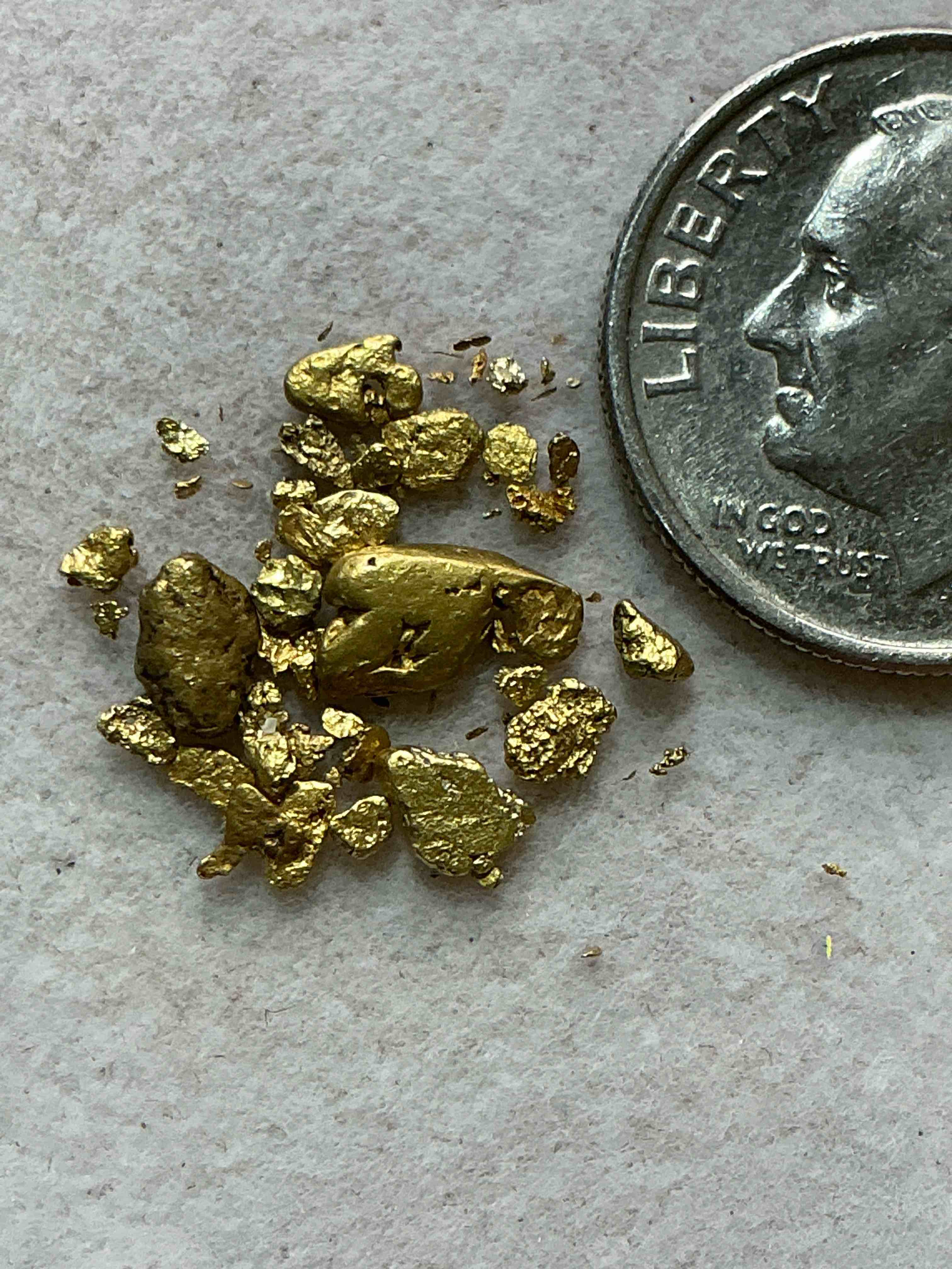 Condition photo showing New/Like New for genuine gold nuggets! approximately 1 gram of prospected gold nuggets! gold nuggets fresh from prospecting north carolina mountains, total weight of all nuggets is approximately 1 gram! these gold nuggets test at between approx 22-24 karat. gold in raw, prospected form is extremely hard to find & much rarer than any refined form. get in on the gold craze... gold has increased in value over 40% since 2025! u.s. dime for size reference only (not included). case in image included. own genuine, gold nuggets!