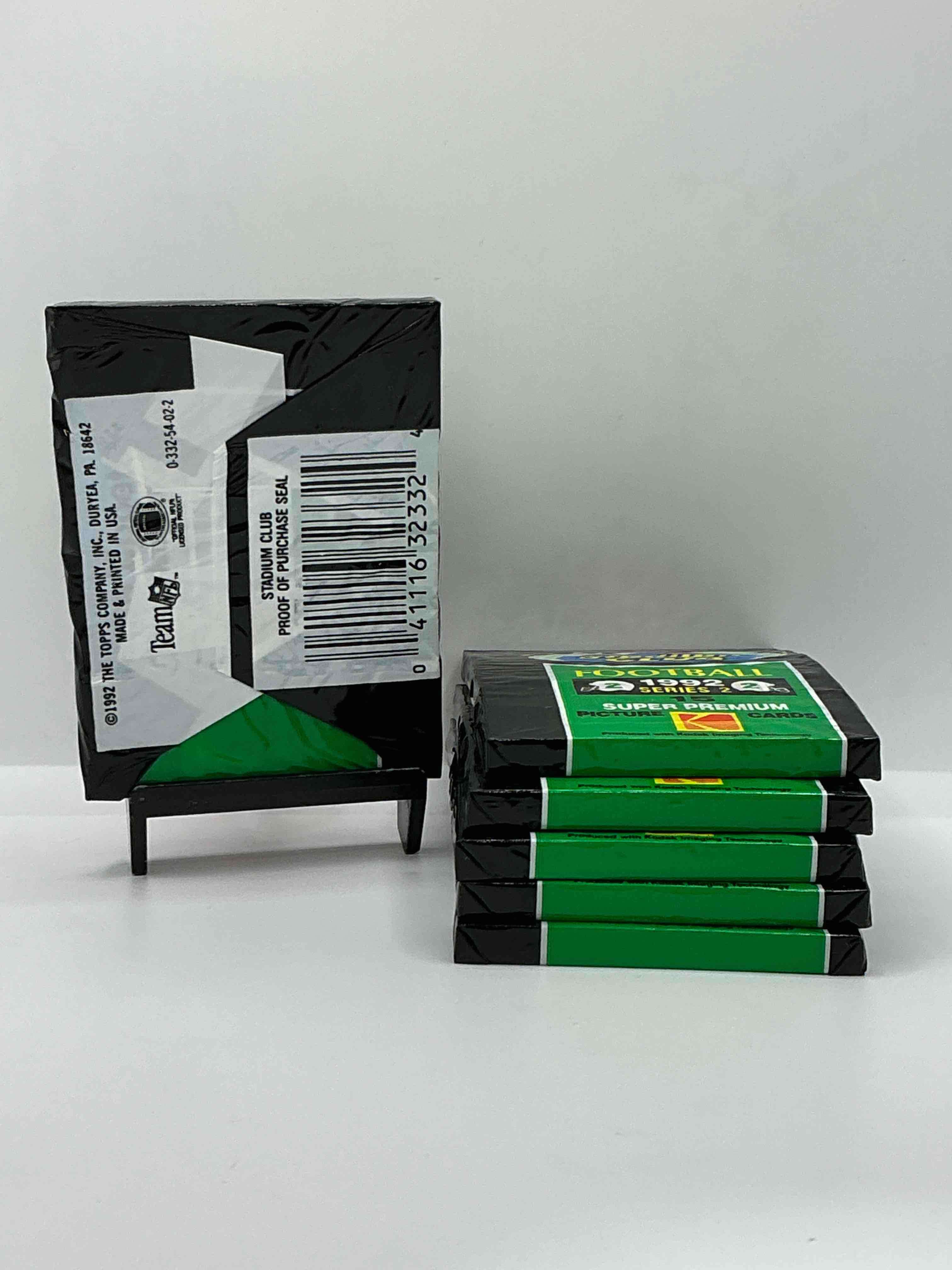 Condition photo showing New/Like New for rare! 1992 topps stadium club unopened wax pack, direct from original sealed retail case. sought after by collectors because each pack has a topps gold card! search for tons of stars like montana, rice, barry sanders, emmitt smith & so much more!