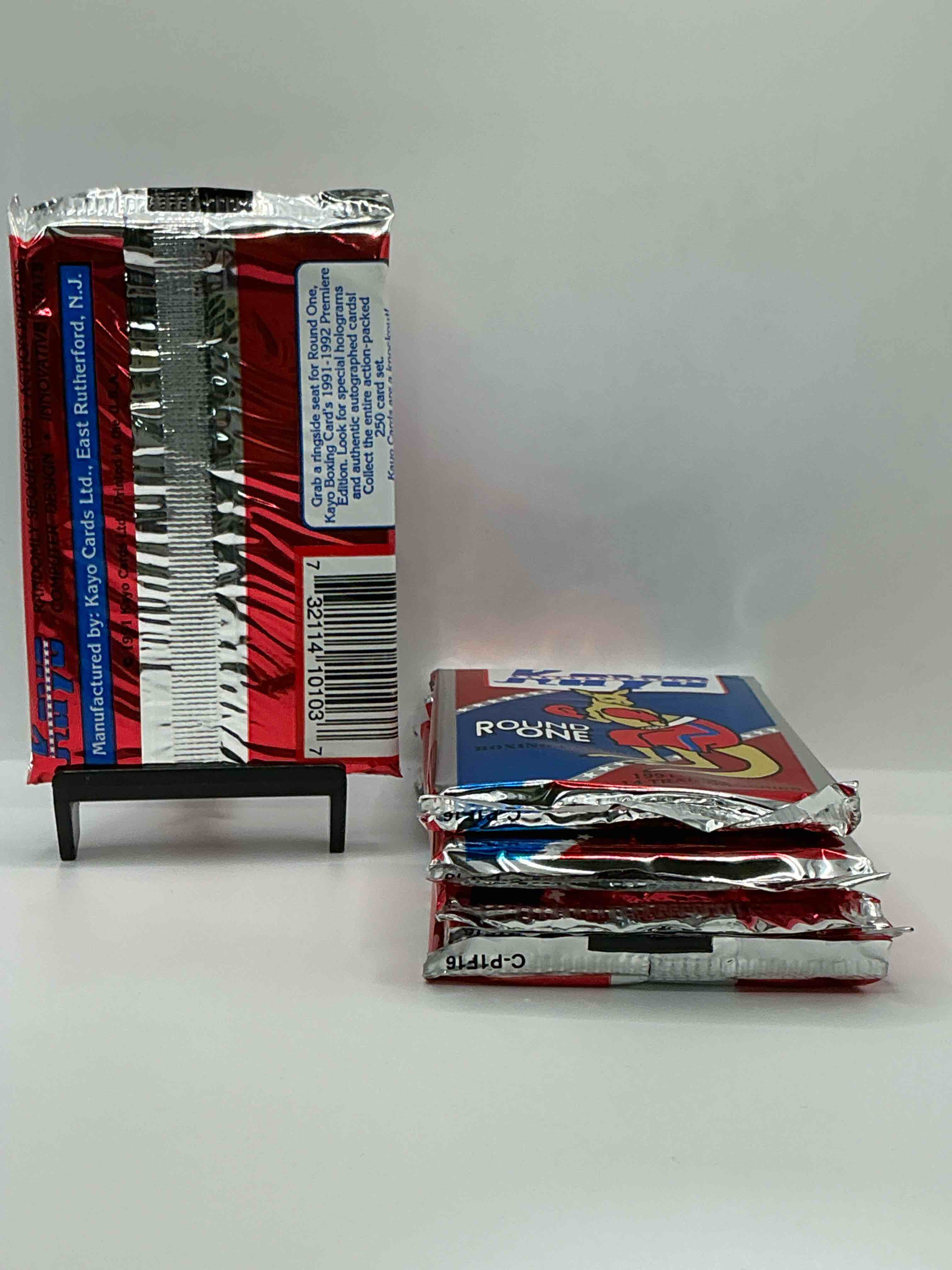 Condition photo showing New/Like New for 1991-92 kayo round one boxing cards! 14 cards per pack! look for roy jones jr, lennox lewis, james toney & more! beautiful packs!